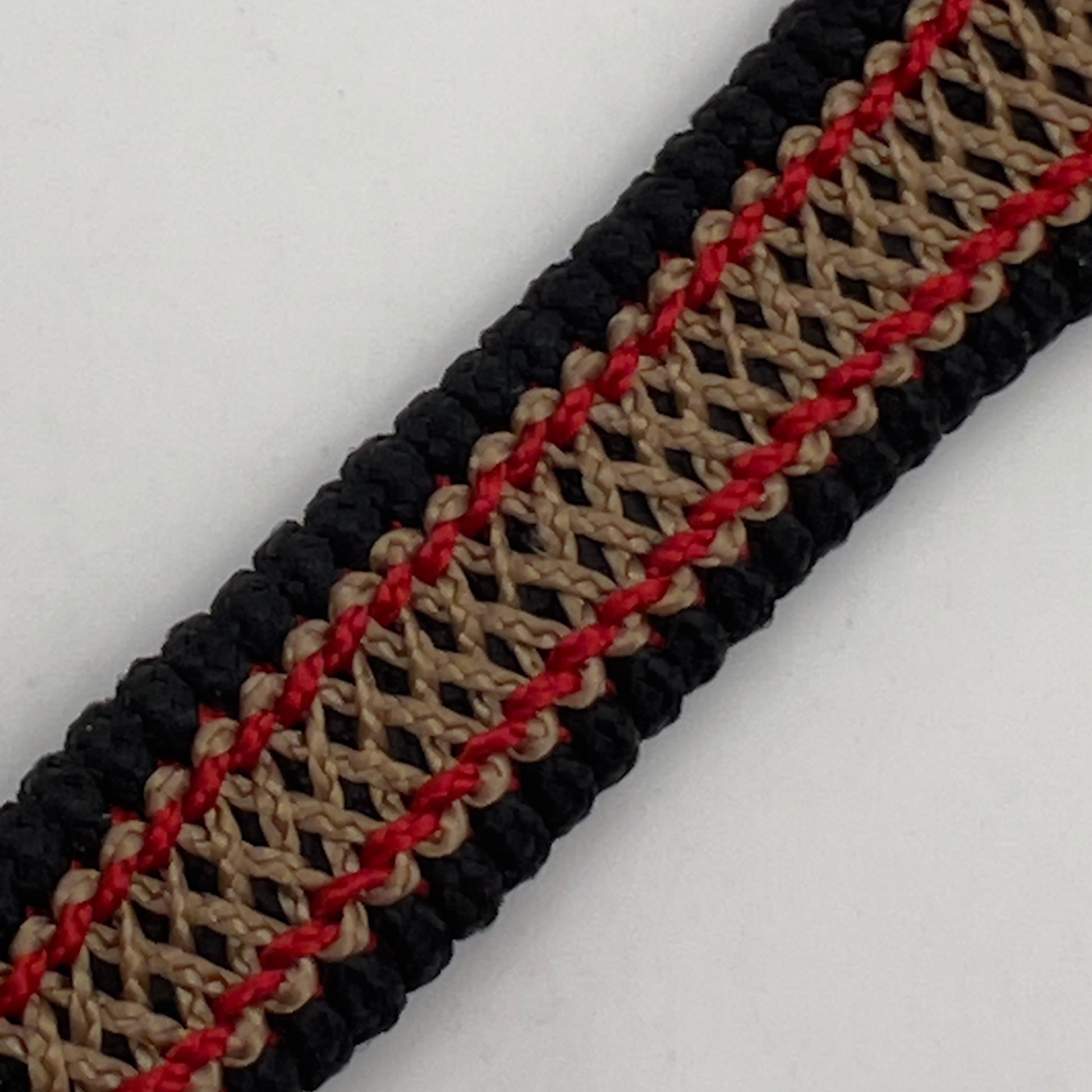 Thin, narrow, very thin and flexible and comfortable braided United States Marine Corps bracelet featuring a 24K antique gold plated USMC Eagle Globe and Anchor medallion, a black Cobra style tactical buckle and woven with black Type-1 paracord and Imperial Red and GOld nano cord.