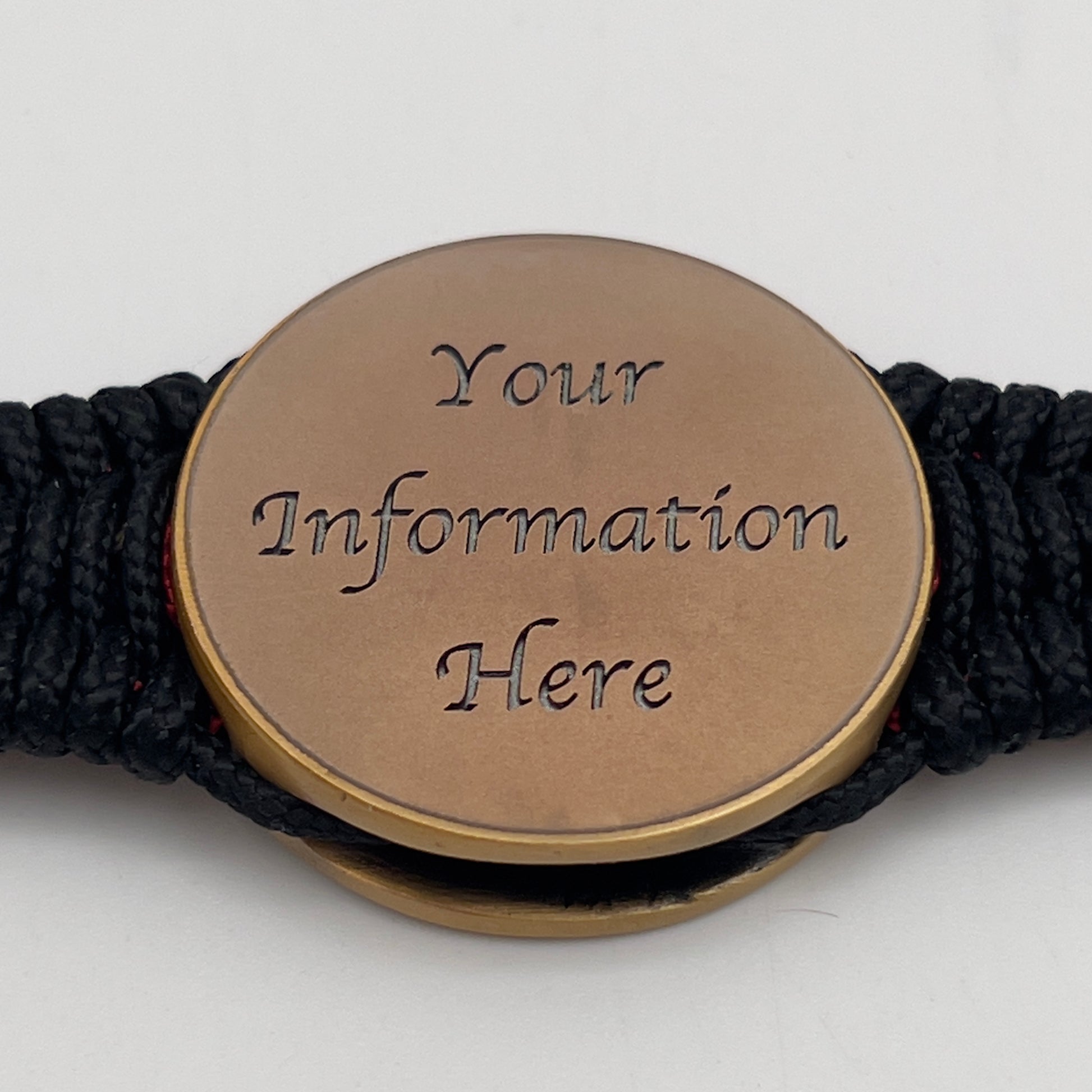 Thin, narrow, very thin and flexible and comfortable braided United States Marine Corps bracelet featuring a 24K antique gold plated USMC Eagle Globe and Anchor medallion, a black Cobra style tactical buckle and woven with black Type-1 paracord and Imperial Red and GOld nano cord.