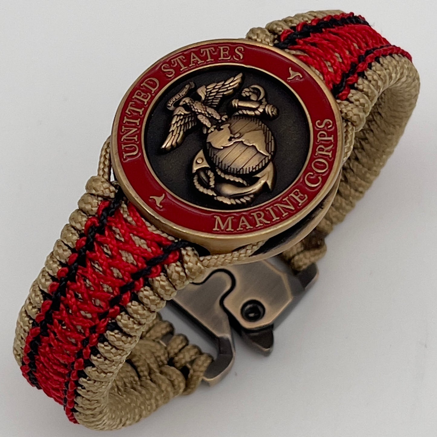 Thin, narrow, very thin and flexible and comfortable braided United States Marine Corps bracelet featuring a 24K antique gold plated USMC Eagle Globe and Anchor medallion, a gold Cobra style tactical buckle and woven with gold Type-1 paracord and Imperial Red and Black nano cord.