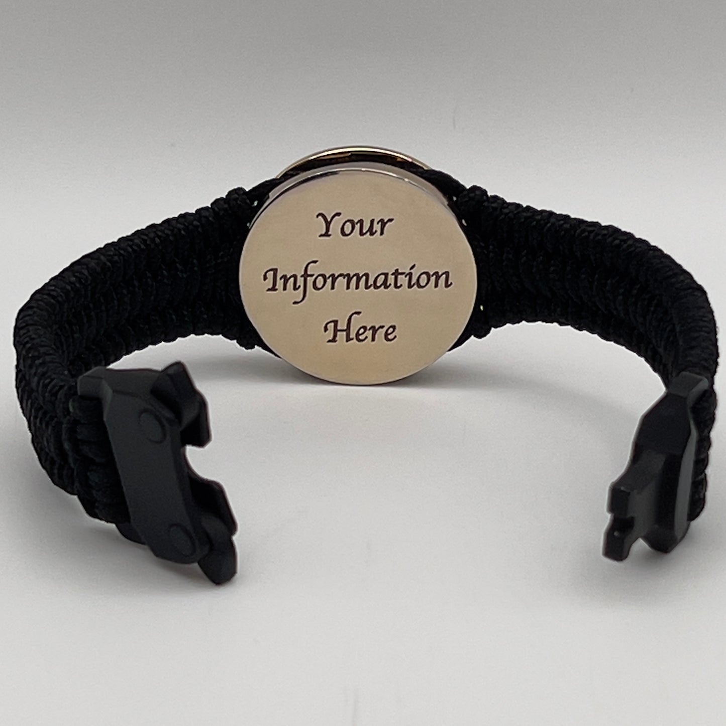 Thin, narrow, flexible and comfortable braided United States Marine Corps bracelet featuring a 24K gold and silver plated USMC Eagle Globe and Anchor medallion, a black Cobra style tactical buckle and woven with black type-1 paracord.
