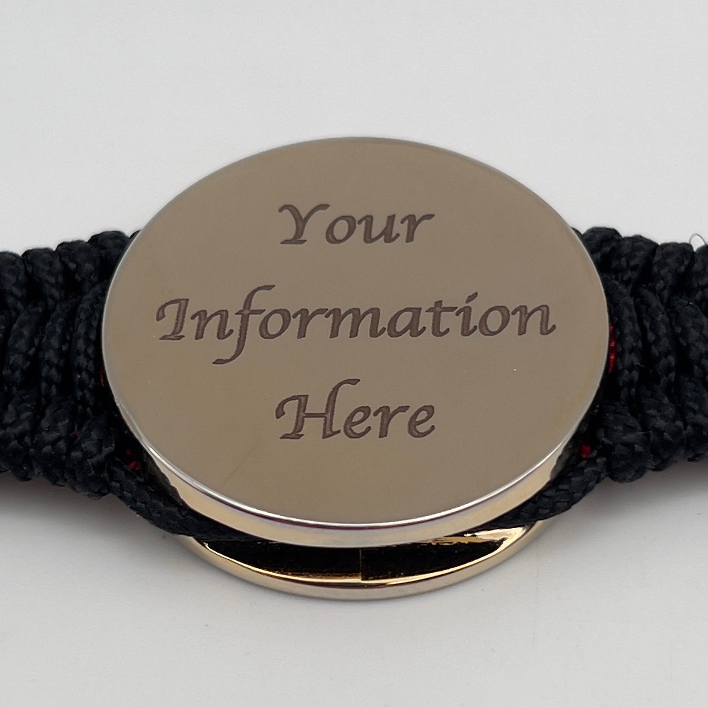 Thin, narrow, flexible and comfortable braided United States Marine Corps bracelet featuring a 24K gold plated USMC Eagle Globe and Anchor medallion, a black Cobra style tactical buckle and woven with black Type-1 paracord and Imperial Red and Gold nano cord.