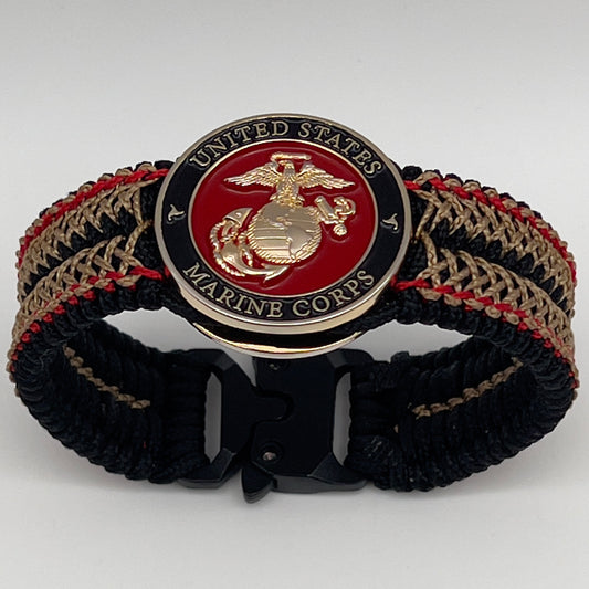 Thin, narrow, flexible and comfortable braided United States Marine Corps bracelet featuring a 24K gold plated USMC Eagle Globe and Anchor medallion, a black Cobra style tactical buckle and woven with black Type-1 paracord and Imperial Red and Gold nano cord.