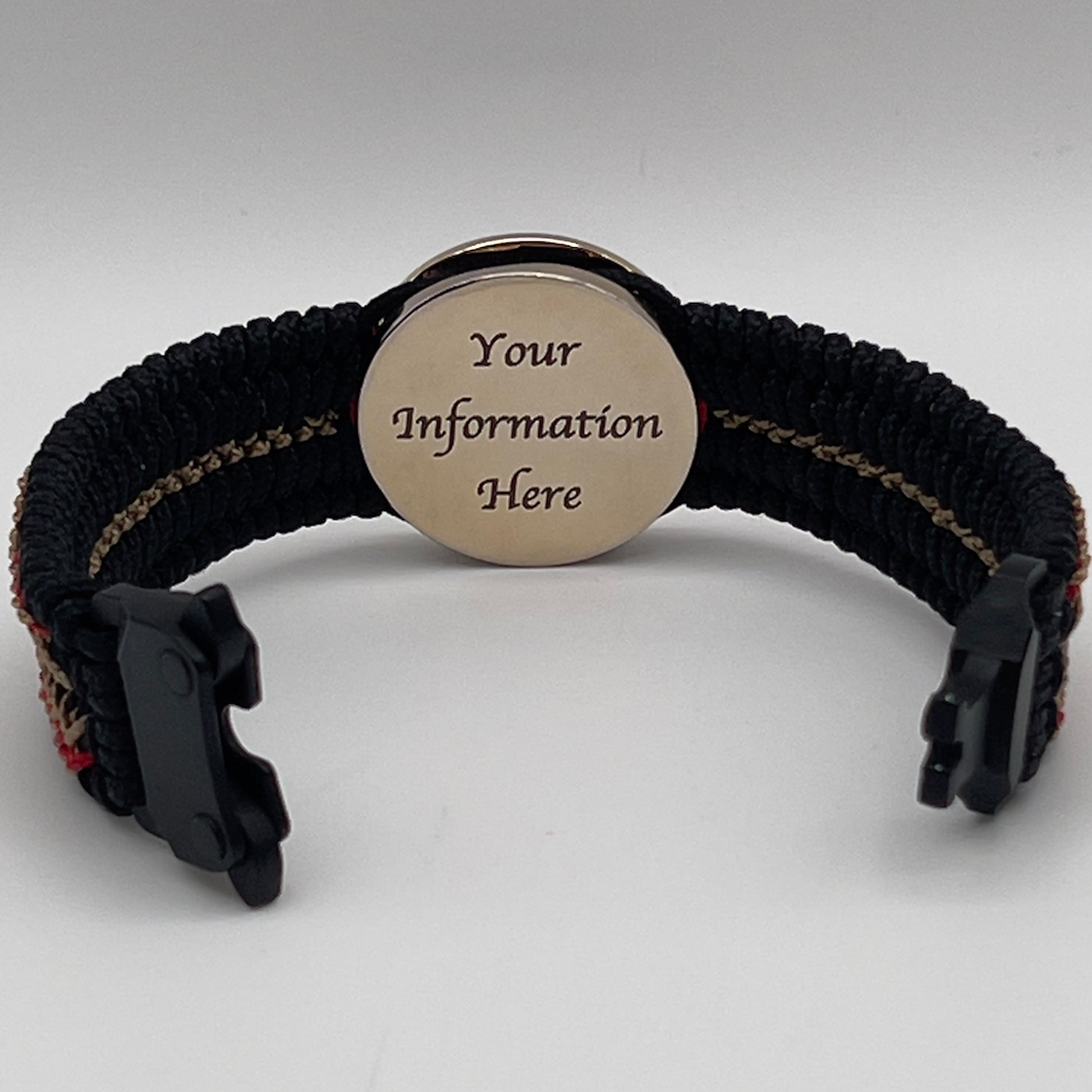Thin, narrow, flexible and comfortable braided United States Marine Corps bracelet featuring a 24K gold plated USMC Eagle Globe and Anchor medallion, a black Cobra style tactical buckle and woven with black Type-1 paracord and Imperial Red and Gold nano cord.