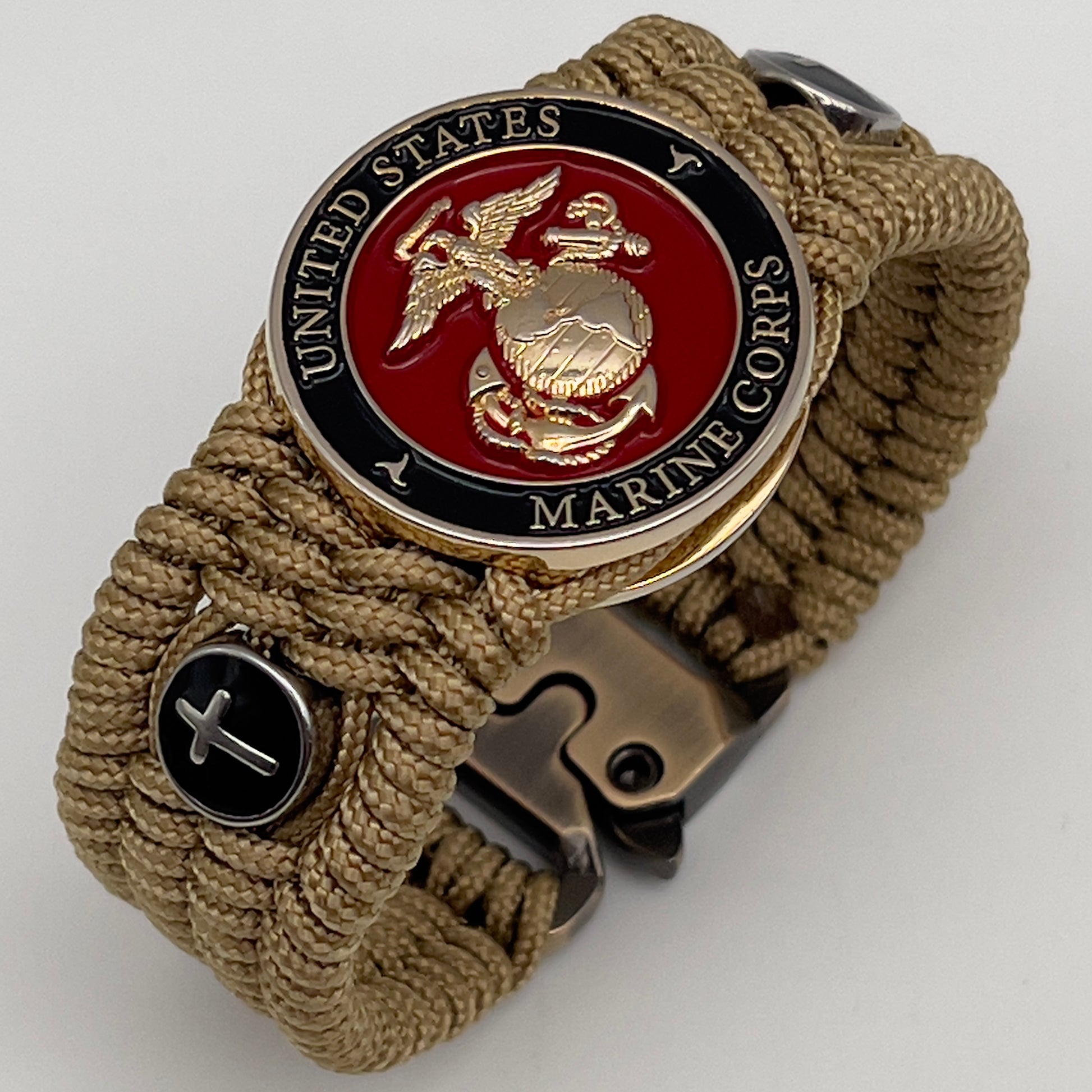 Thin, medium width, flexible and comfortable braided United States Marine Corps bracelet featuring a 24K gold plated USMC officer Eagle Globe and Anchor medallion, two Christian crosses, a gold Cobra style tactical buckle and woven with gold Type-1 paracord.