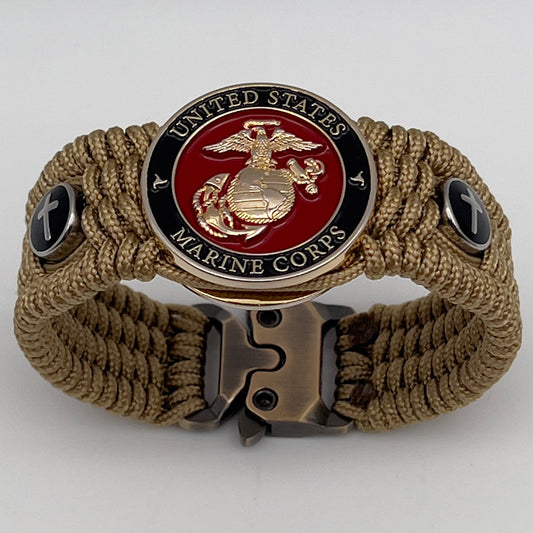 Thin, medium width, flexible and comfortable braided United States Marine Corps bracelet featuring a 24K gold plated USMC officer Eagle Globe and Anchor medallion, two Christian crosses, a gold Cobra style tactical buckle and woven with gold Type-1 paracord.