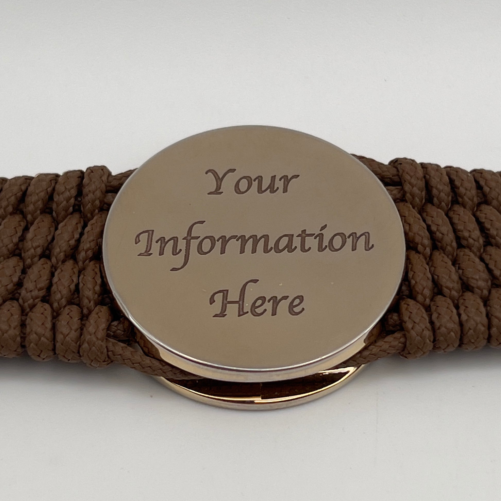 Thin, medium width, flexible and comfortable braided United States Marine Corps bracelet featuring a 24K gold plated USMC officer Eagle Globe and Anchor medallion, a gold Cobra style tactical buckle and woven with Coyote Brown Type-1 paracord.