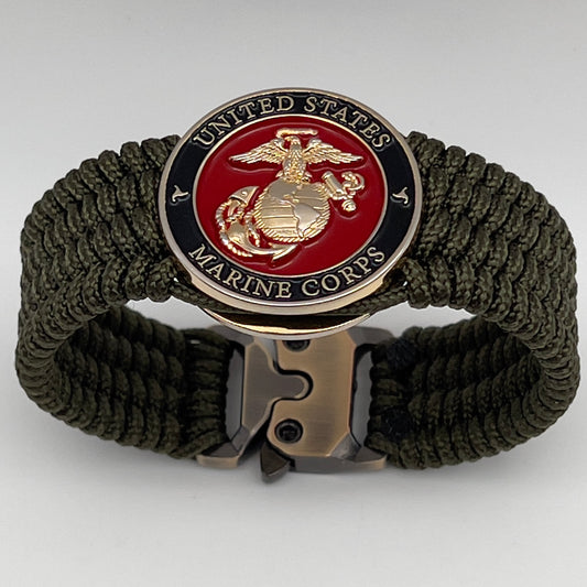 Thin, medium width, flexible and comfortable braided United States Marine Corps bracelet featuring a 24K gold plated USMC officer Eagle Globe and Anchor medallion, a gold Cobra style tactical buckle and woven with Olive Drab Type-1 paracord.