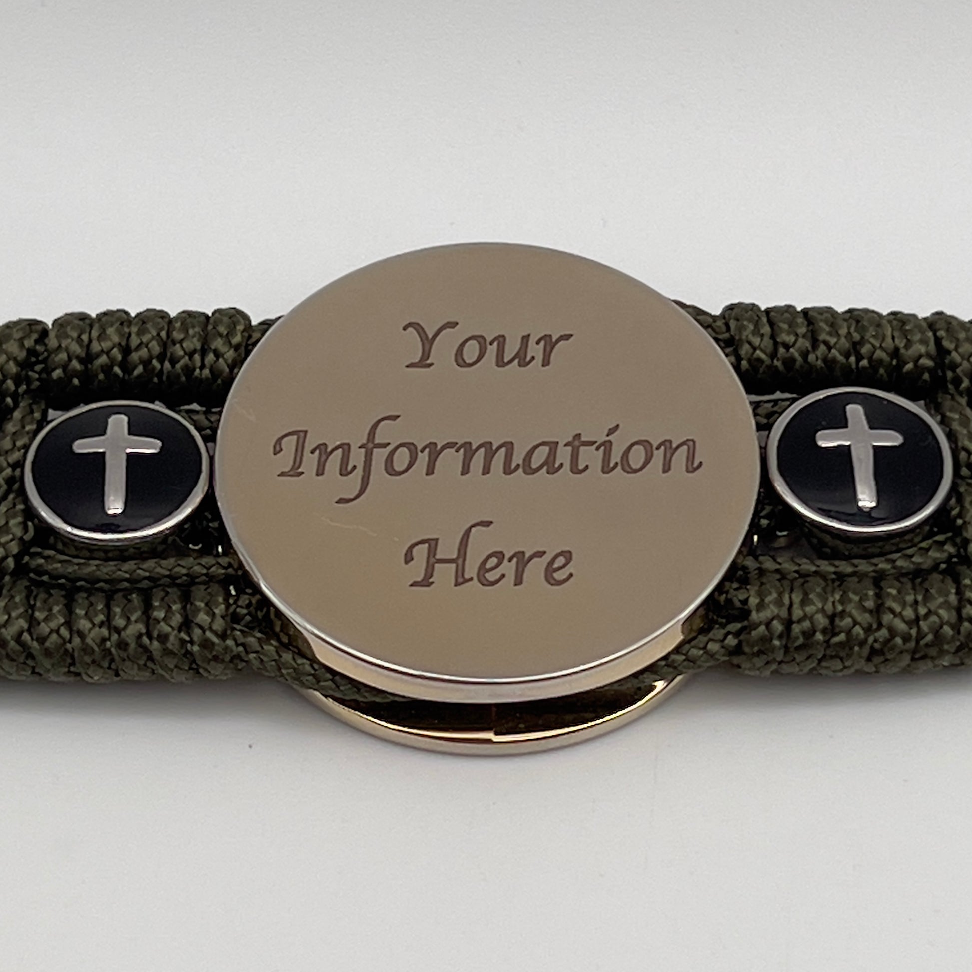 Thin, medium width, flexible and comfortable braided United States Marine Corps bracelet featuring a 24K gold plated USMC officer Eagle Globe and Anchor medallion, two Christian crosses, a black Cobra style tactical buckle and woven with Olive Drab Type-1 paracord.