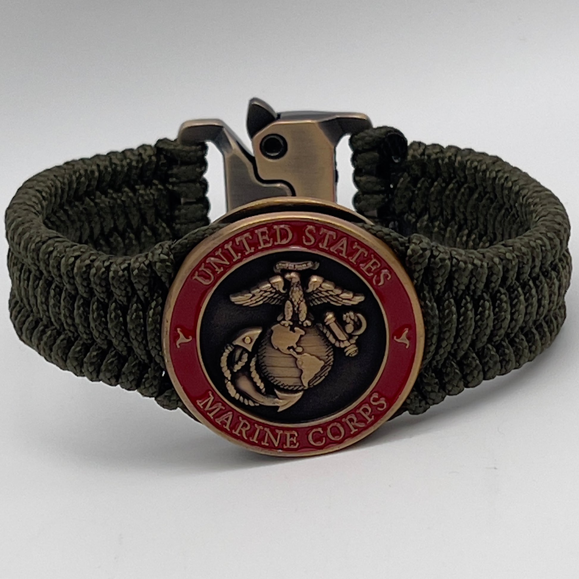 Thin, narrow, flexible and comfortable braided United States Marine Corps bracelet featuring a 24K antique gold plated USMC Eagle Globe and Anchor medallion, a gold Cobra style tactical buckle and woven with Olive Drab Type-1 paracord.
