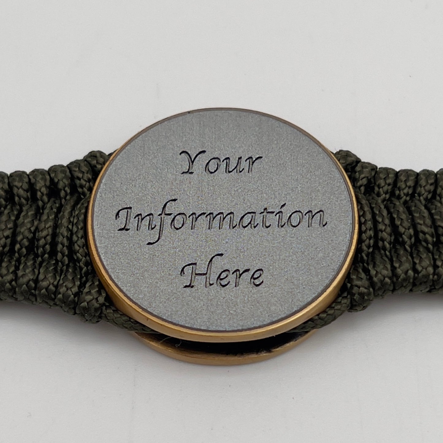 Thin, narrow, flexible and comfortable braided United States Marine Corps bracelet featuring a 24K antique gold plated USMC Eagle Globe and Anchor medallion, a gold Cobra style tactical buckle and woven with Olive Drab Type-1 paracord.