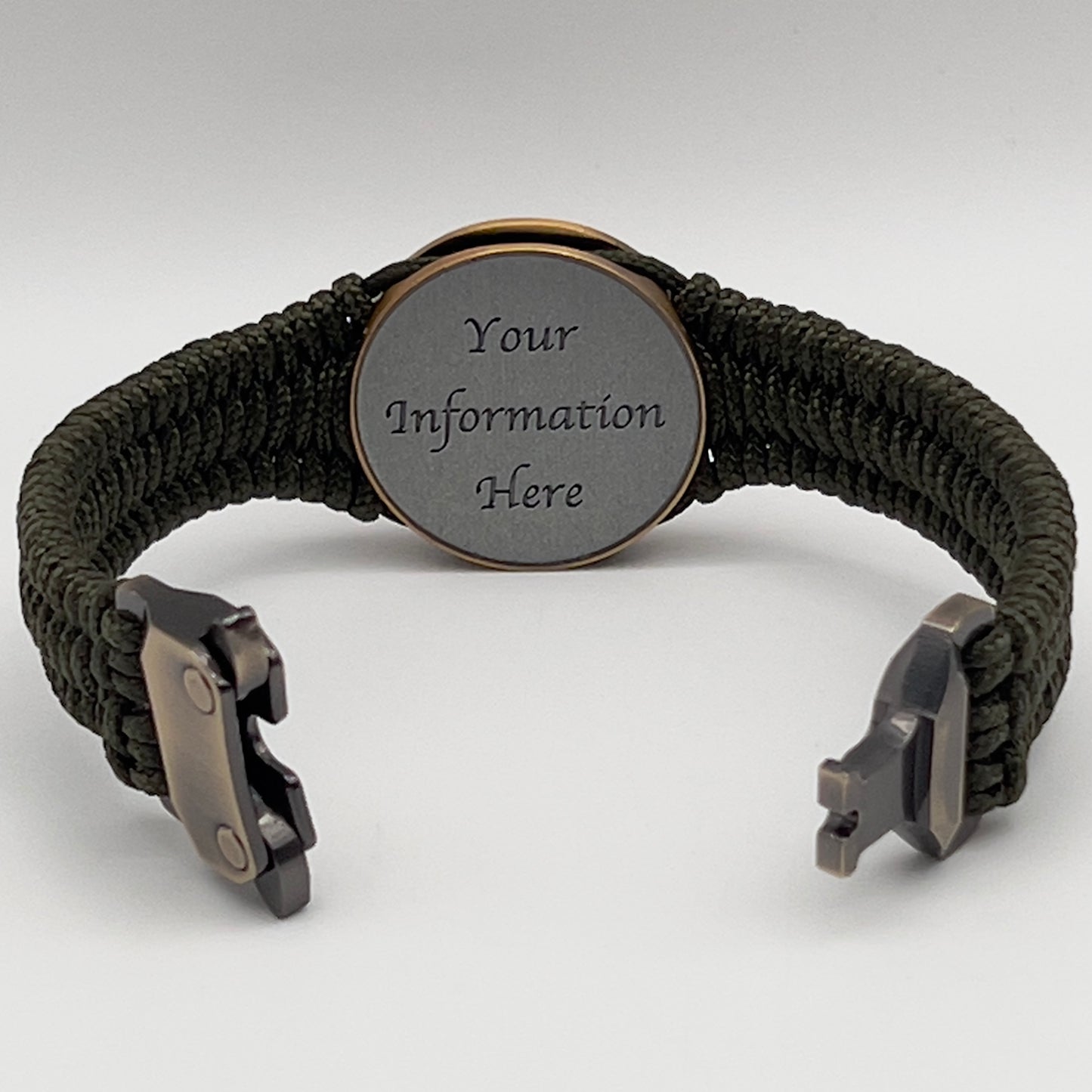 Thin, narrow, flexible and comfortable braided United States Marine Corps bracelet featuring a 24K antique gold plated USMC Eagle Globe and Anchor medallion, a gold Cobra style tactical buckle and woven with Olive Drab Type-1 paracord.