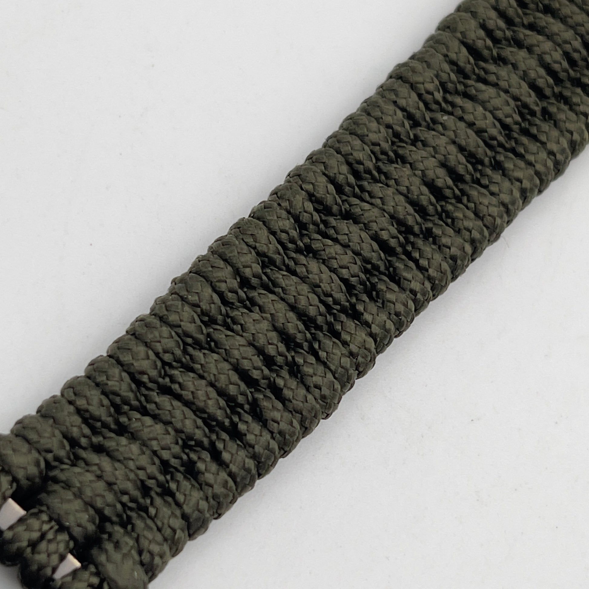 Thin, narrow, flexible and comfortable braided United States Marine Corps bracelet featuring a 24K antique gold plated USMC Eagle Globe and Anchor medallion, a gold Cobra style tactical buckle and woven with Olive Drab Type-1 paracord.