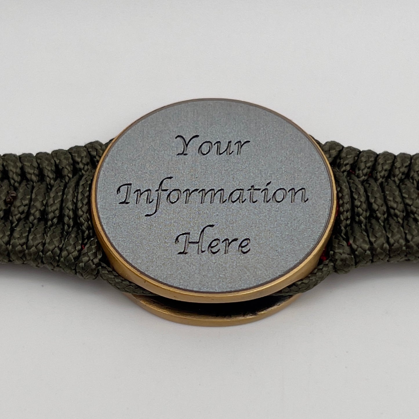 Thin, narrow, flexible and comfortable braided United States Marine Corps bracelet featuring a 24K antique gold plated USMC Eagle Globe and Anchor medallion, a gold Cobra style tactical buckle and woven with Olive Drab Type-1 paracord and Imperial Red and Gold nano cord.