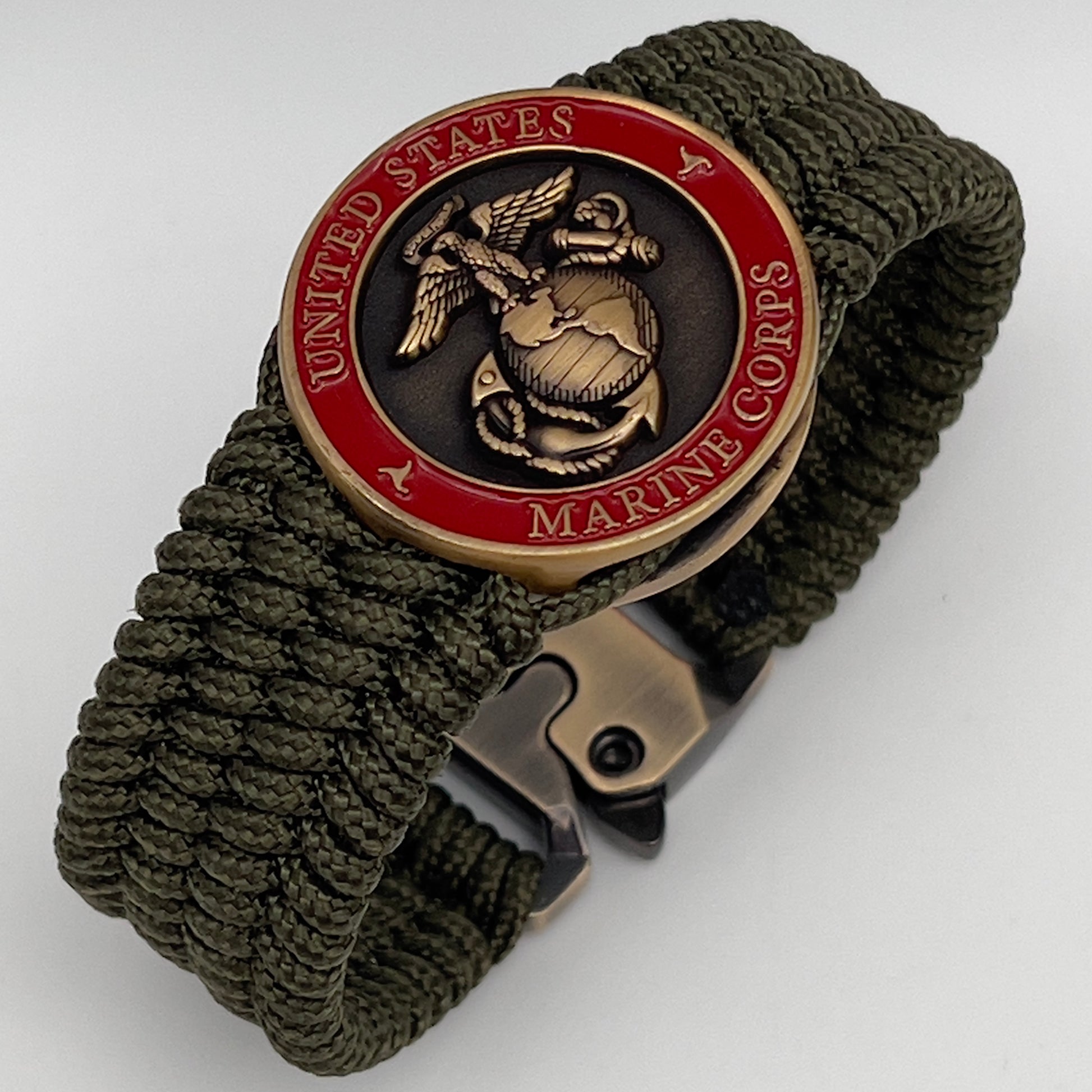 Thin, medium wide, flexible and comfortable braided United States Marine Corps bracelet featuring a 24K antique gold plated USMC Eagle Globe and Anchor medallion, a gold Cobra style tactical buckle and woven with Olive Drab Type-1 paracord.