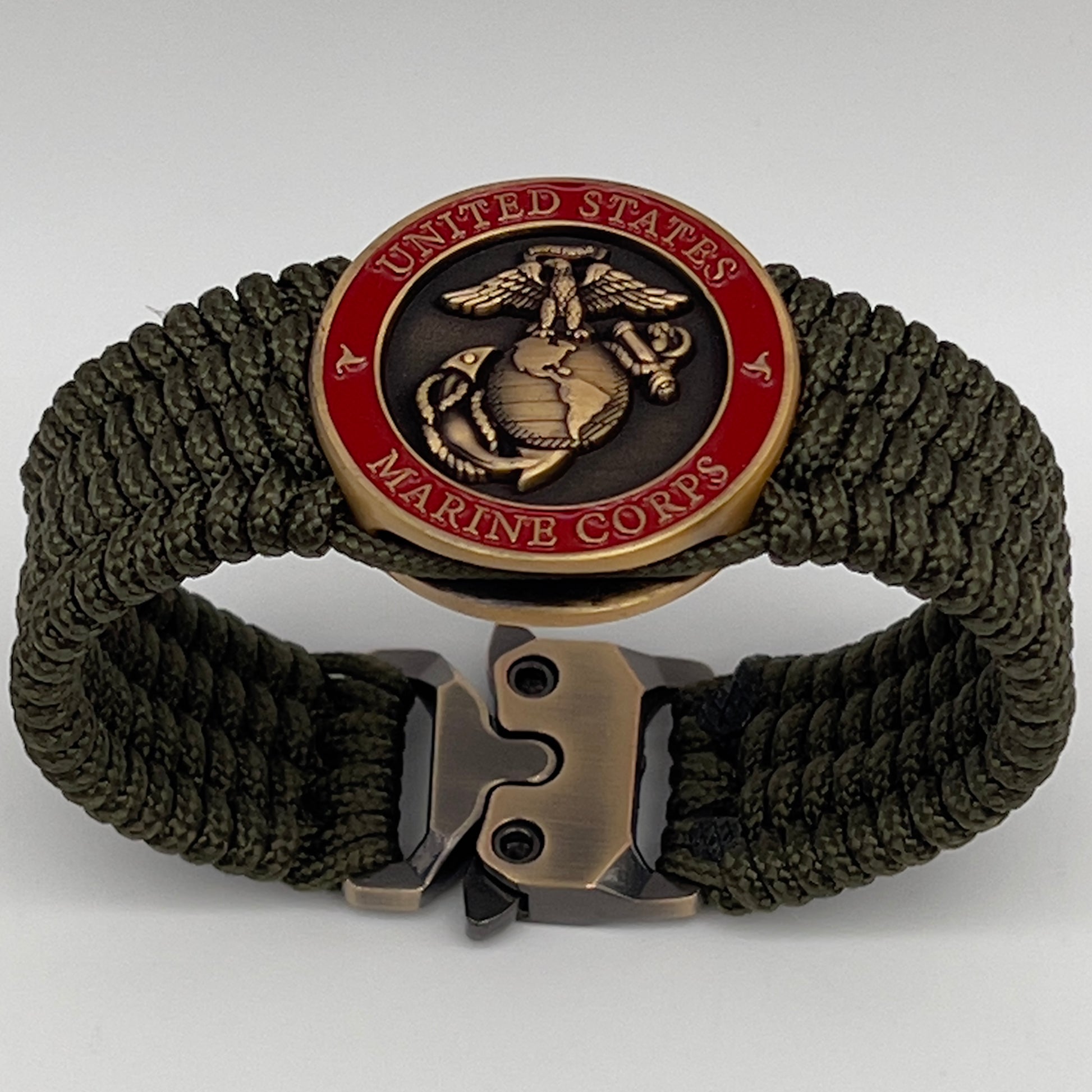 Thin, medium wide, flexible and comfortable braided United States Marine Corps bracelet featuring a 24K antique gold plated USMC Eagle Globe and Anchor medallion, a gold Cobra style tactical buckle and woven with Olive Drab Type-1 paracord.