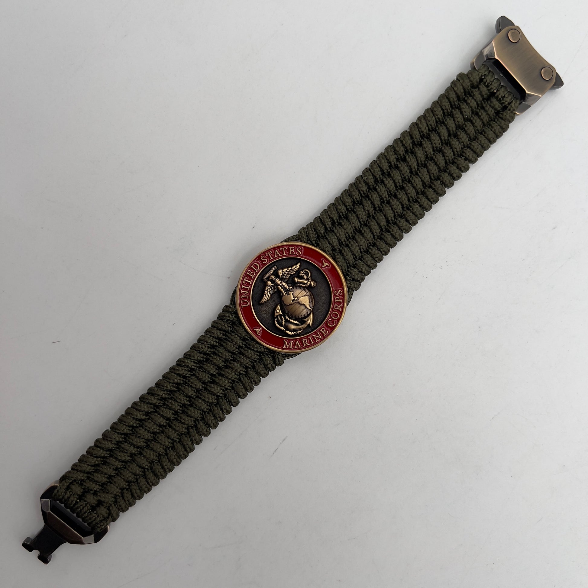 Thin, medium wide, flexible and comfortable braided United States Marine Corps bracelet featuring a 24K antique gold plated USMC Eagle Globe and Anchor medallion, a gold Cobra style tactical buckle and woven with Olive Drab Type-1 paracord.