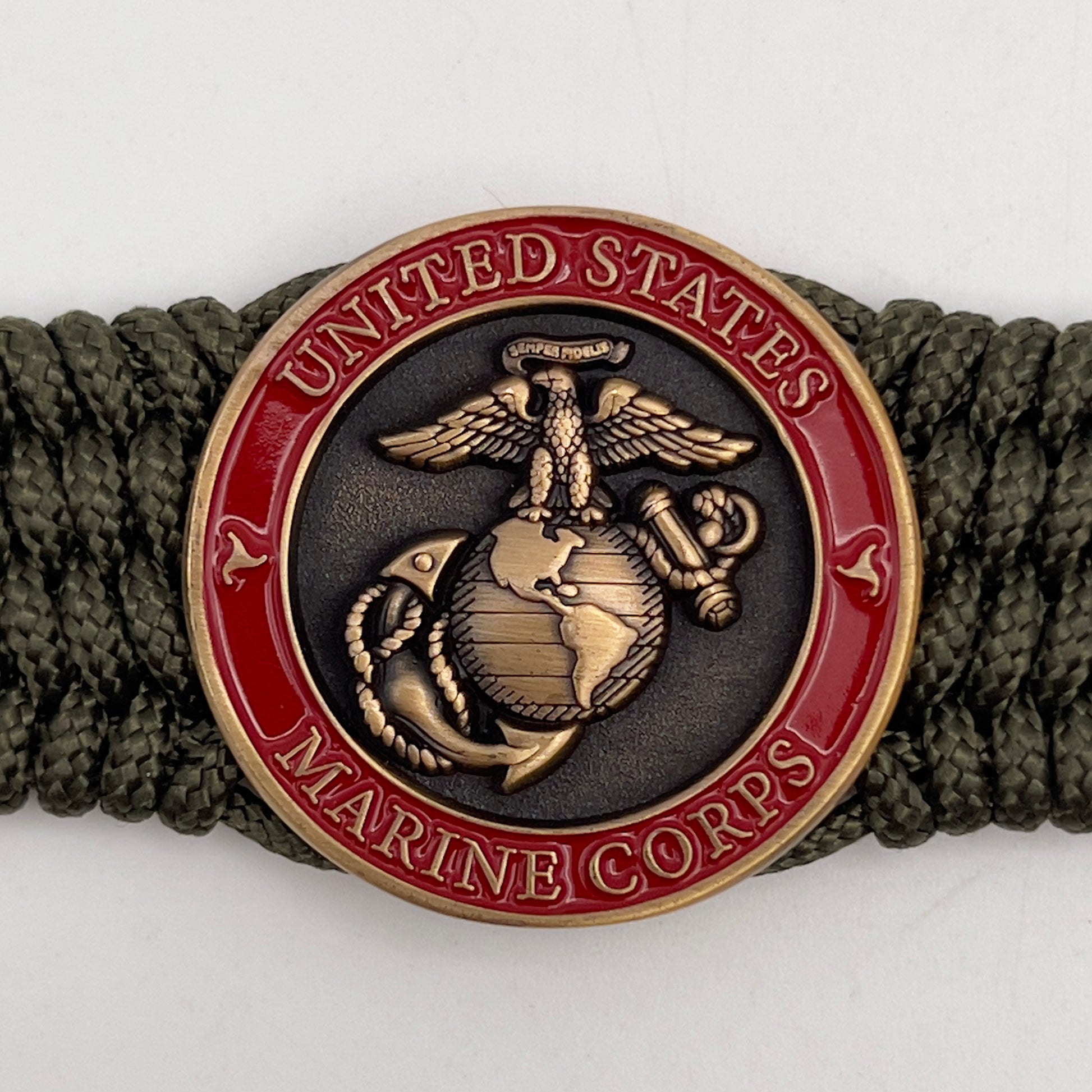 Thin, medium wide, flexible and comfortable braided United States Marine Corps bracelet featuring a 24K antique gold plated USMC Eagle Globe and Anchor medallion, a gold Cobra style tactical buckle and woven with Olive Drab Type-1 paracord.