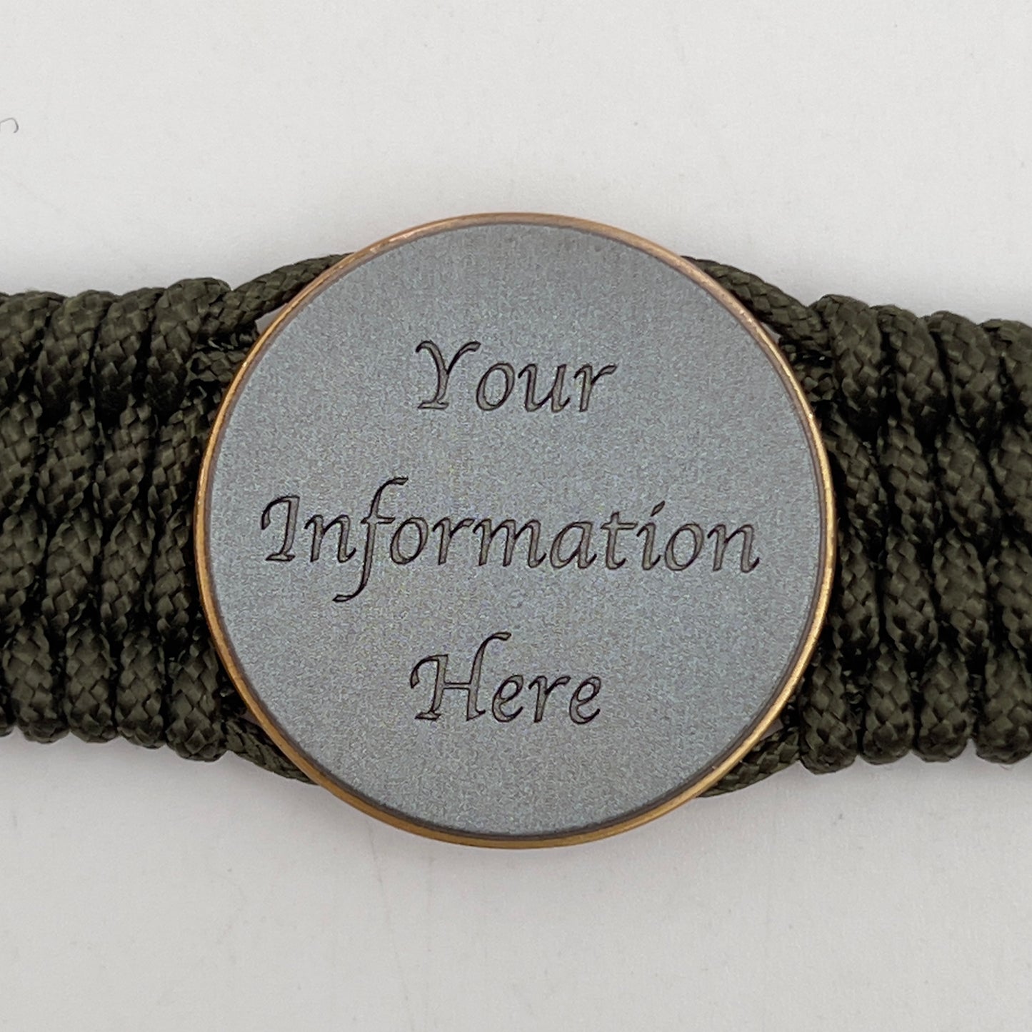 Thin, medium wide, flexible and comfortable braided United States Marine Corps bracelet featuring a 24K antique gold plated USMC Eagle Globe and Anchor medallion, a gold Cobra style tactical buckle and woven with Olive Drab Type-1 paracord.
