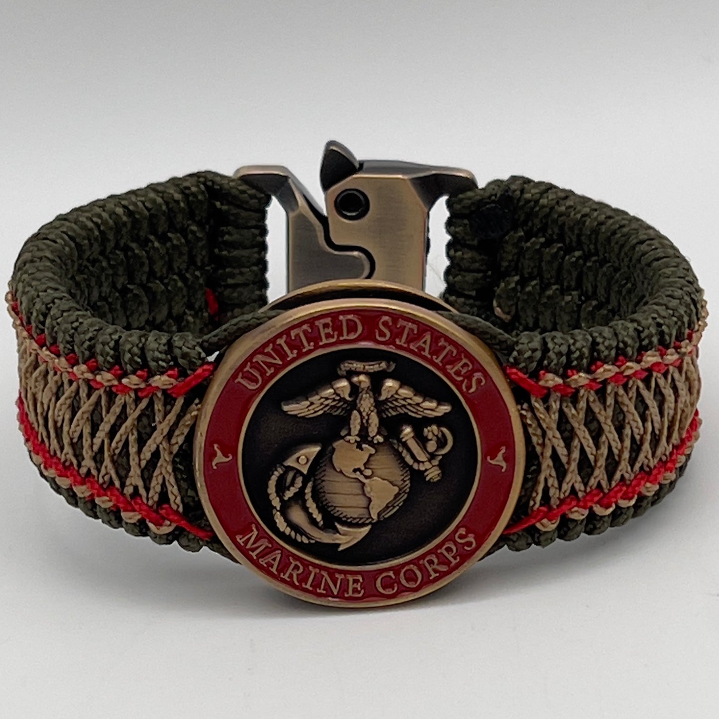 Thin, medium width, flexible and comfortable braided United States Marine Corps bracelet featuring a 24K antique gold plated USMC Eagle Globe and Anchor medallion, a gold Cobra style tactical buckle and woven with Olive Drab Type-1 paracord and Imperial Red and Gold nano cord.
