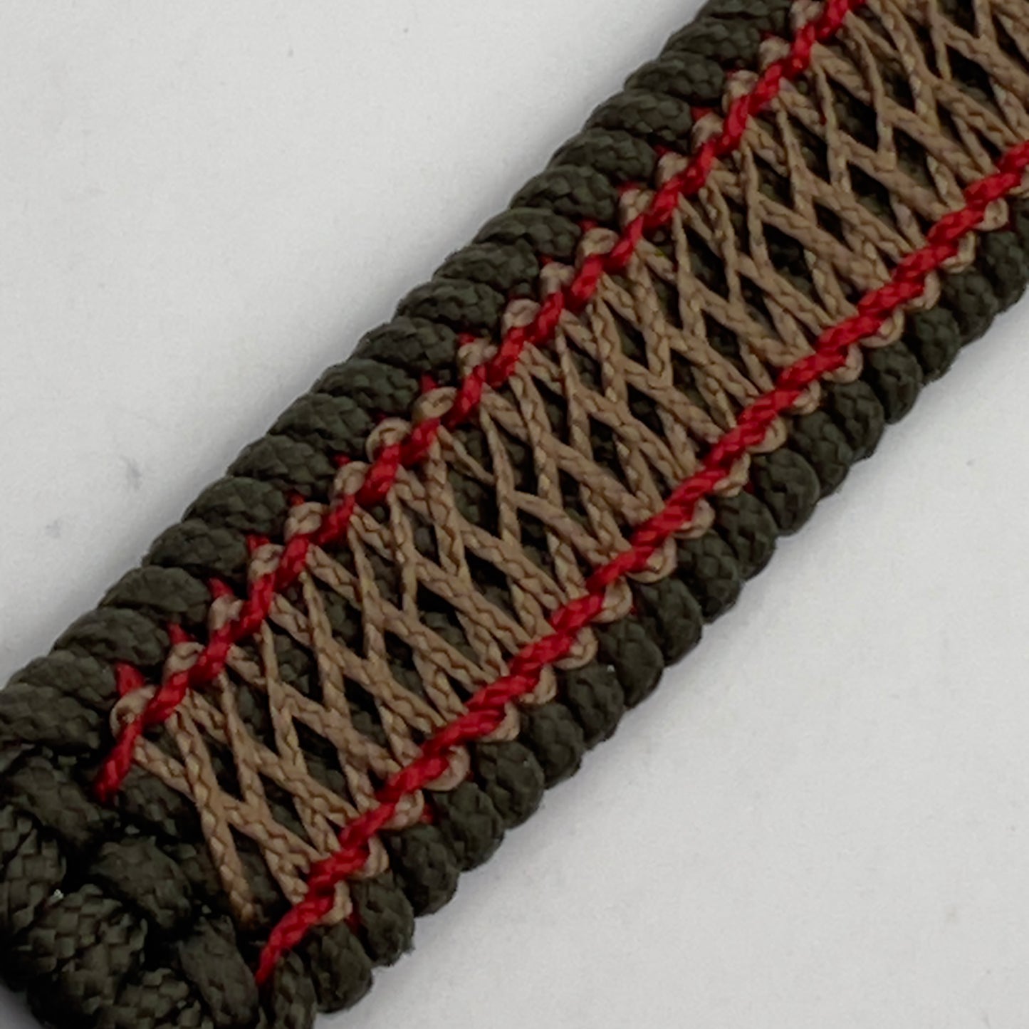 Thin, medium width, flexible and comfortable braided United States Marine Corps bracelet featuring a 24K antique gold plated USMC Eagle Globe and Anchor medallion, a gold Cobra style tactical buckle and woven with Olive Drab Type-1 paracord and Imperial Red and Gold nano cord.