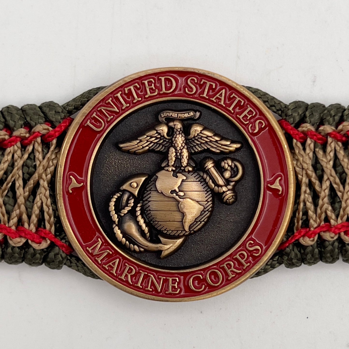 Thin, medium width, flexible and comfortable braided United States Marine Corps bracelet featuring a 24K antique gold plated USMC Eagle Globe and Anchor medallion, a gold Cobra style tactical buckle and woven with Olive Drab Type-1 paracord and Imperial Red and Gold nano cord.