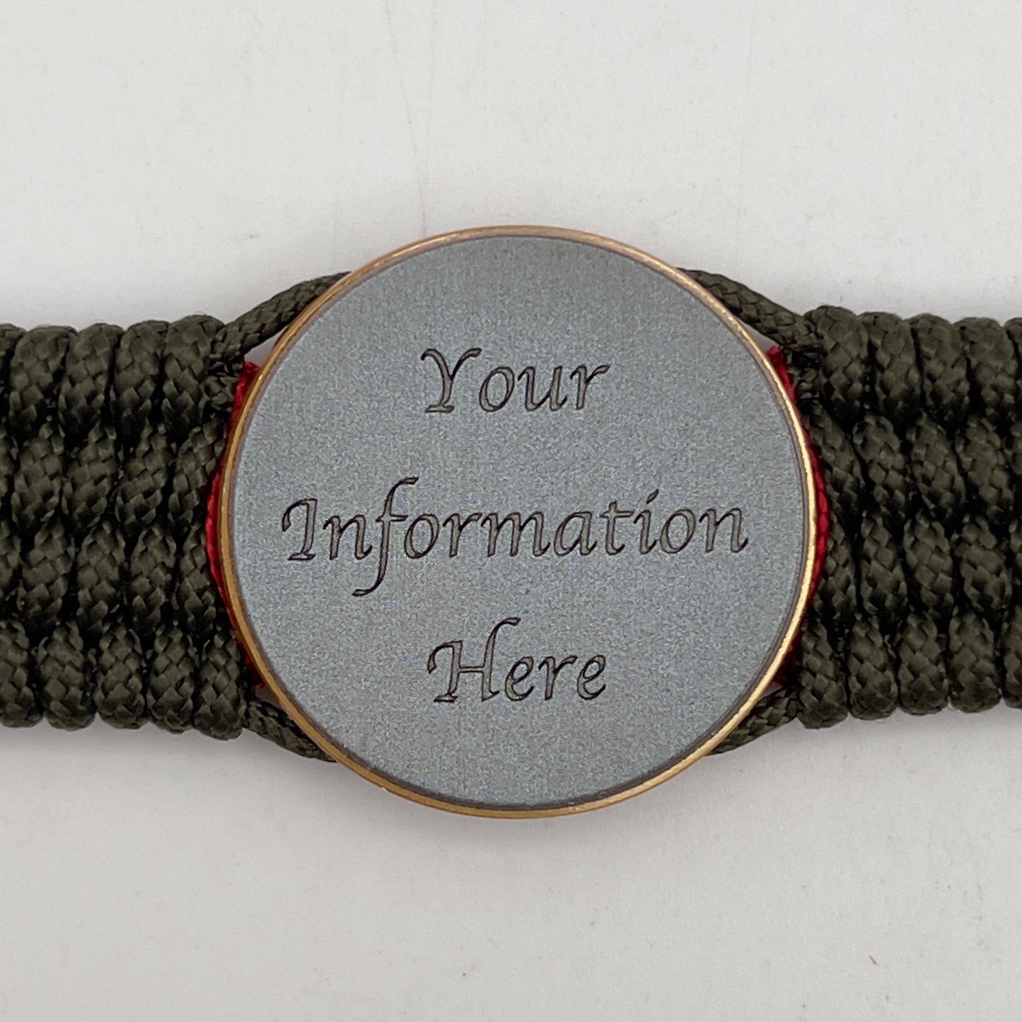 Thin, medium width, flexible and comfortable braided United States Marine Corps bracelet featuring a 24K antique gold plated USMC Eagle Globe and Anchor medallion, a gold Cobra style tactical buckle and woven with Olive Drab Type-1 paracord and Imperial Red and Gold nano cord.