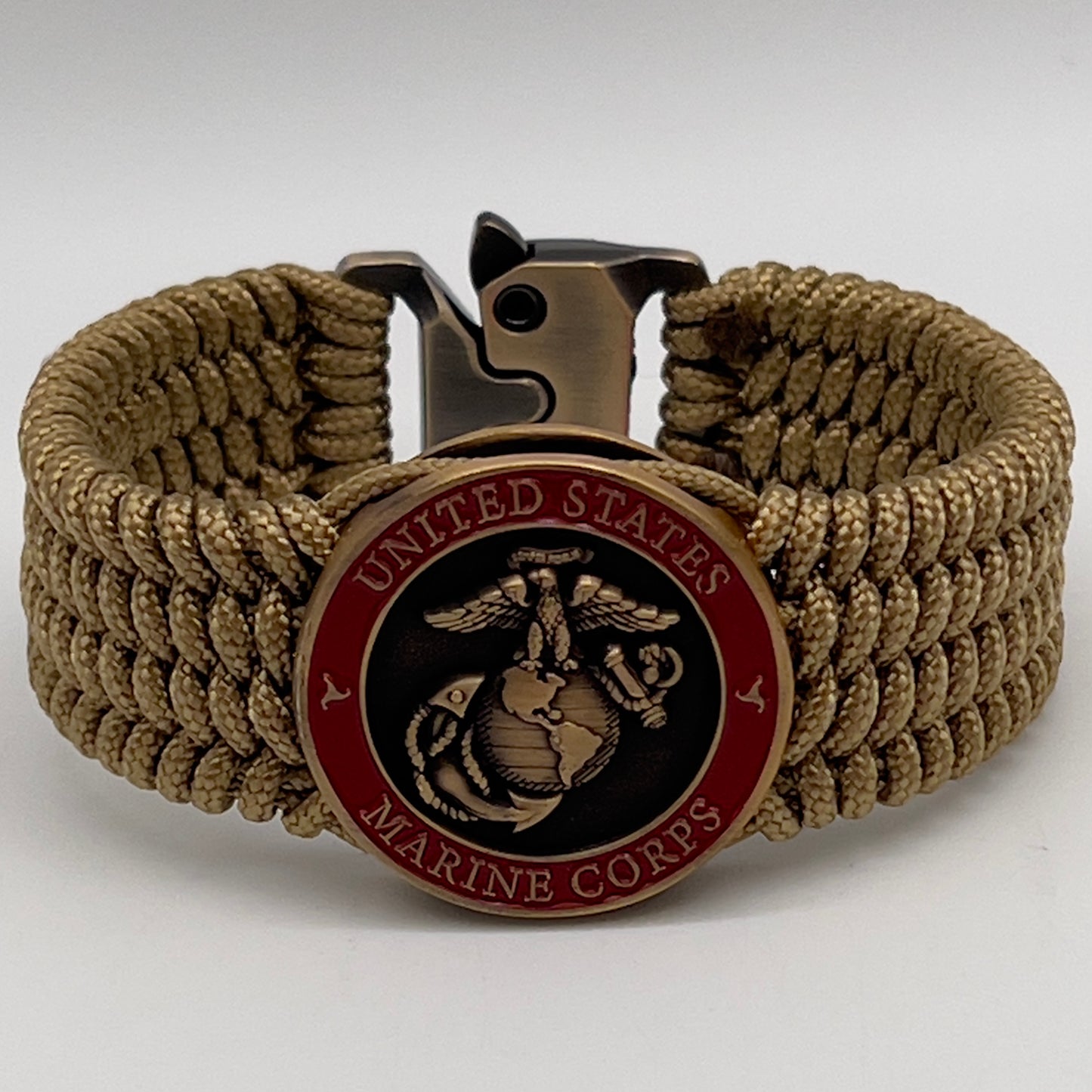 Thin, wide, flexible and comfortable braided United States Marine Corps bracelet featuring a 24K antique gold plated USMC Eagle Globe and Anchor medallion, a gold Cobra style tactical buckle and woven with gold Type-1 paracord.