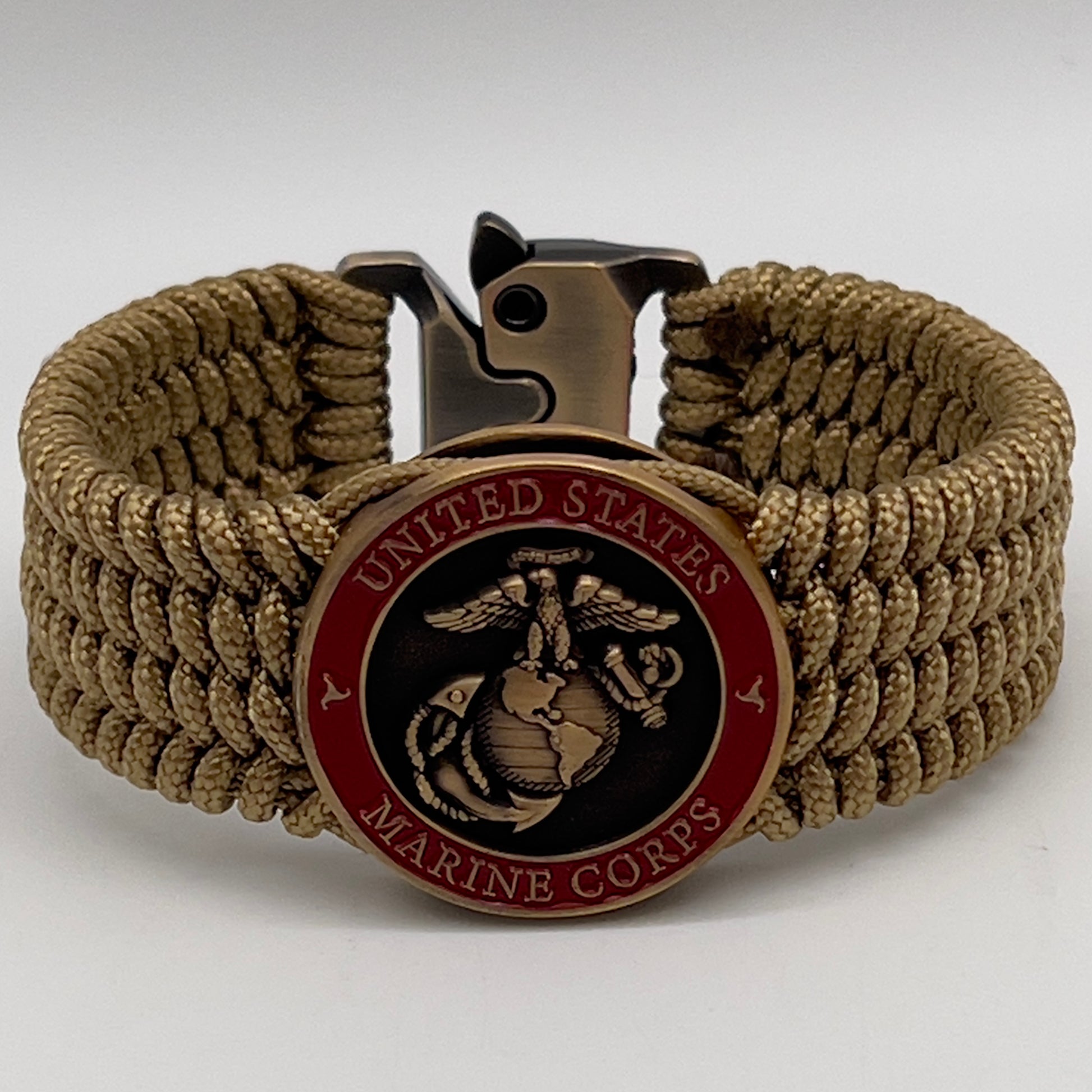 Thin, wide, flexible and comfortable braided United States Marine Corps bracelet featuring a 24K antique gold plated USMC Eagle Globe and Anchor medallion, a gold Cobra style tactical buckle and woven with gold Type-1 paracord.