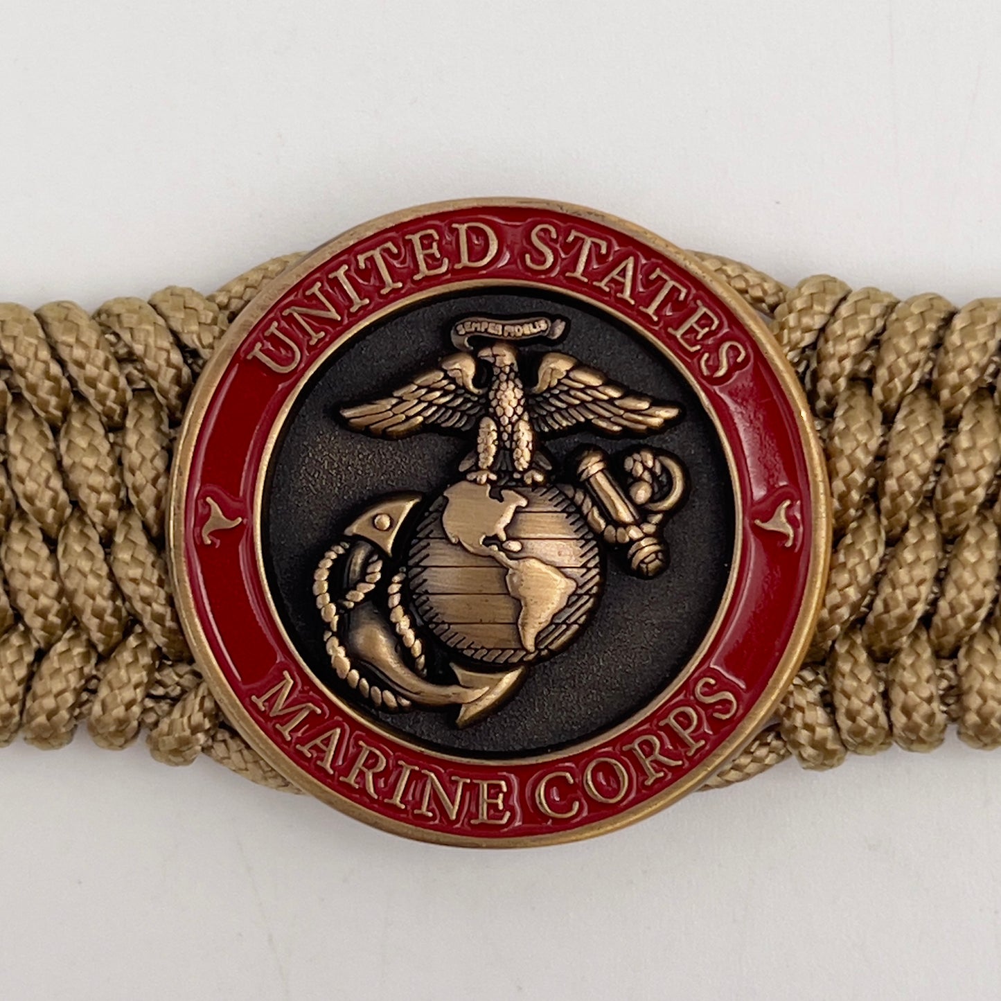 Thin, wide, flexible and comfortable braided United States Marine Corps bracelet featuring a 24K antique gold plated USMC Eagle Globe and Anchor medallion, a gold Cobra style tactical buckle and woven with gold Type-1 paracord.