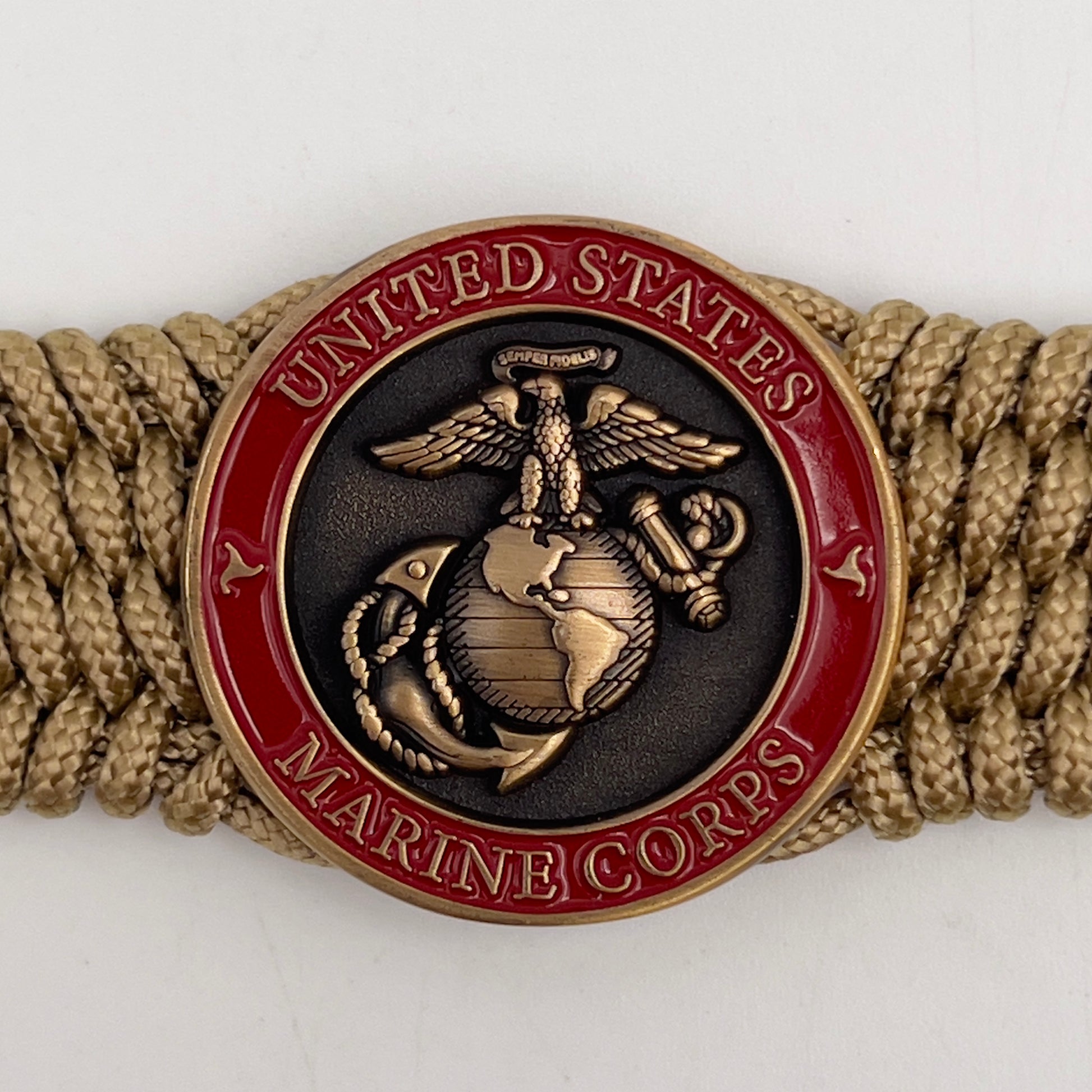 Thin, wide, flexible and comfortable braided United States Marine Corps bracelet featuring a 24K antique gold plated USMC Eagle Globe and Anchor medallion, a gold Cobra style tactical buckle and woven with gold Type-1 paracord.