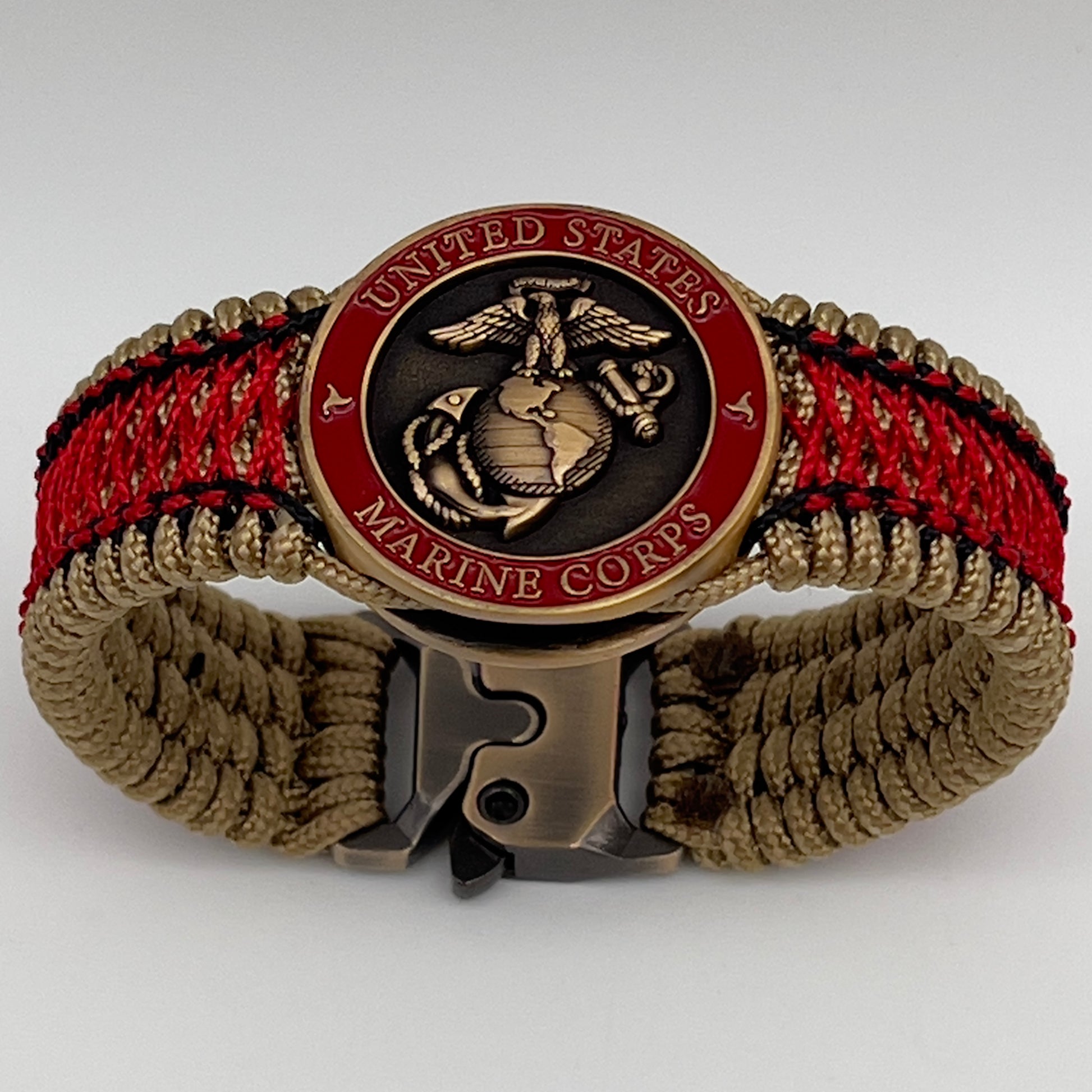 Thin, medium width, flexible and comfortable braided United States Marine Corps bracelet featuring a 24K antique gold plated USMC Eagle Globe and Anchor medallion, a gold Cobra style tactical buckle and woven with gold Type-1 paracord and Imperial Red and Black nano cord.