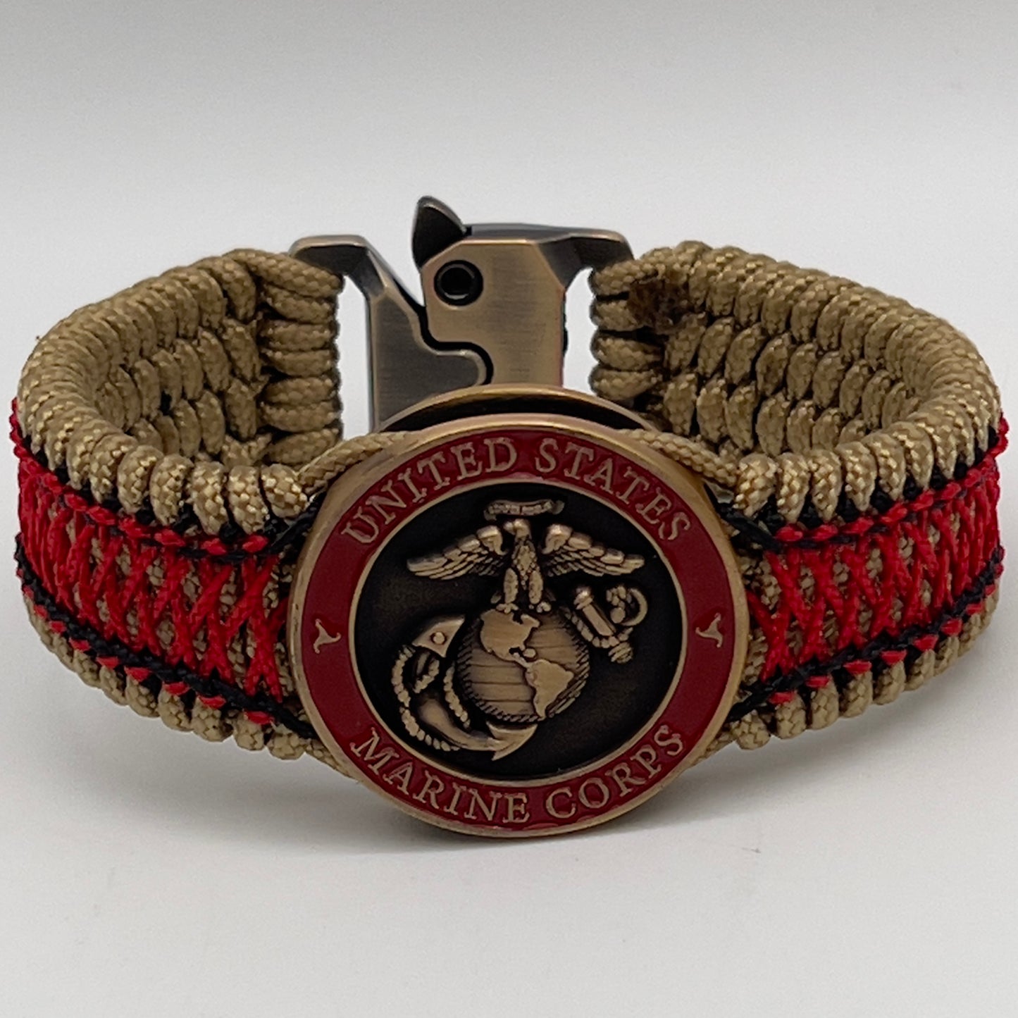 Thin, medium width, flexible and comfortable braided United States Marine Corps bracelet featuring a 24K antique gold plated USMC Eagle Globe and Anchor medallion, a gold Cobra style tactical buckle and woven with gold Type-1 paracord and Imperial Red and Black nano cord.