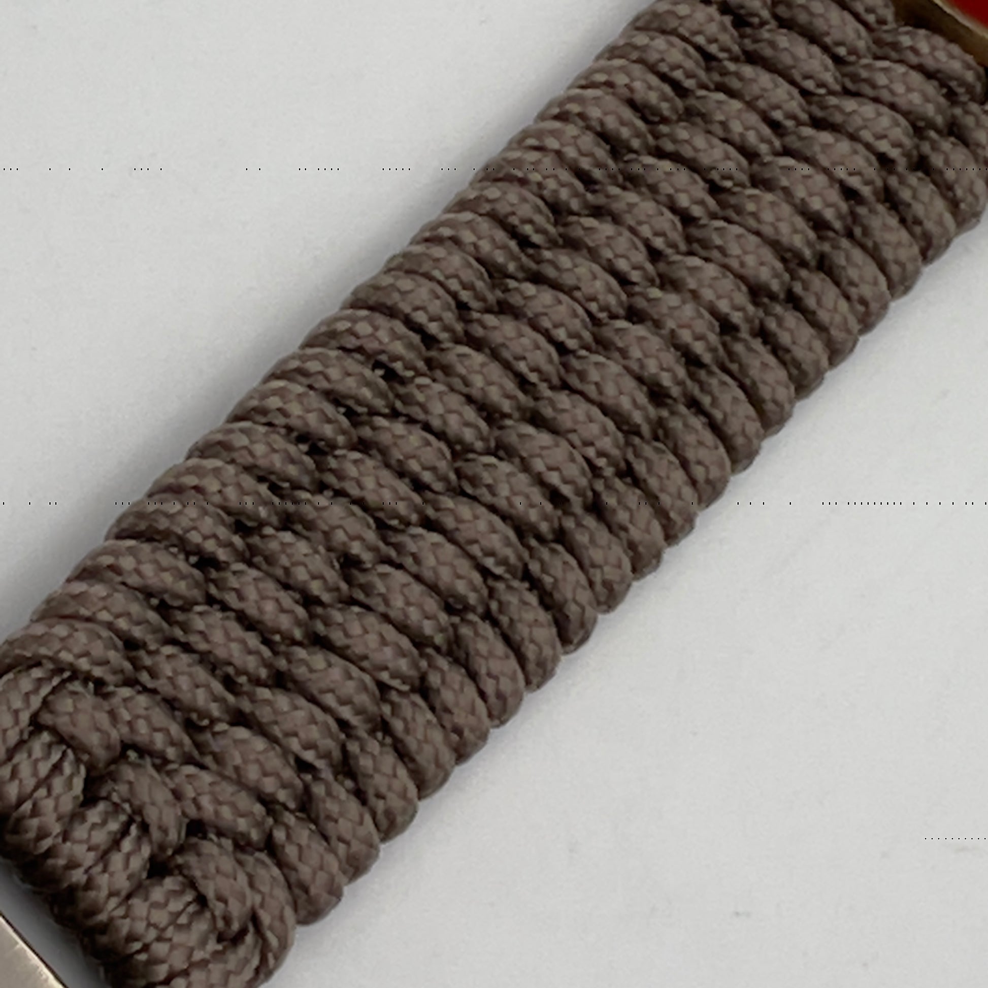 Thin, medium wide, flexible and comfortable braided United States Marine Corps bracelet featuring a 24K antique gold plated USMC Eagle Globe and Anchor medallion, a gold Cobra style tactical buckle and woven with Tan Type-1 paracord.