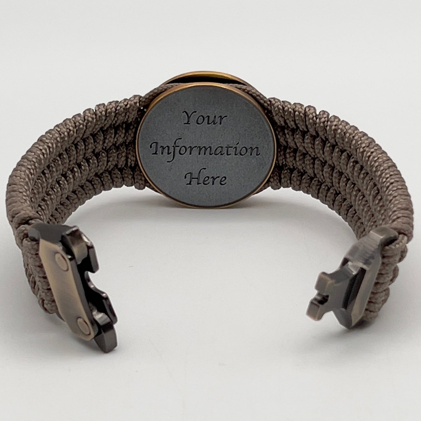 Thin, medium wide, flexible and comfortable braided United States Marine Corps bracelet featuring a 24K antique gold plated USMC Eagle Globe and Anchor medallion, a gold Cobra style tactical buckle and woven with Tan Type-1 paracord.