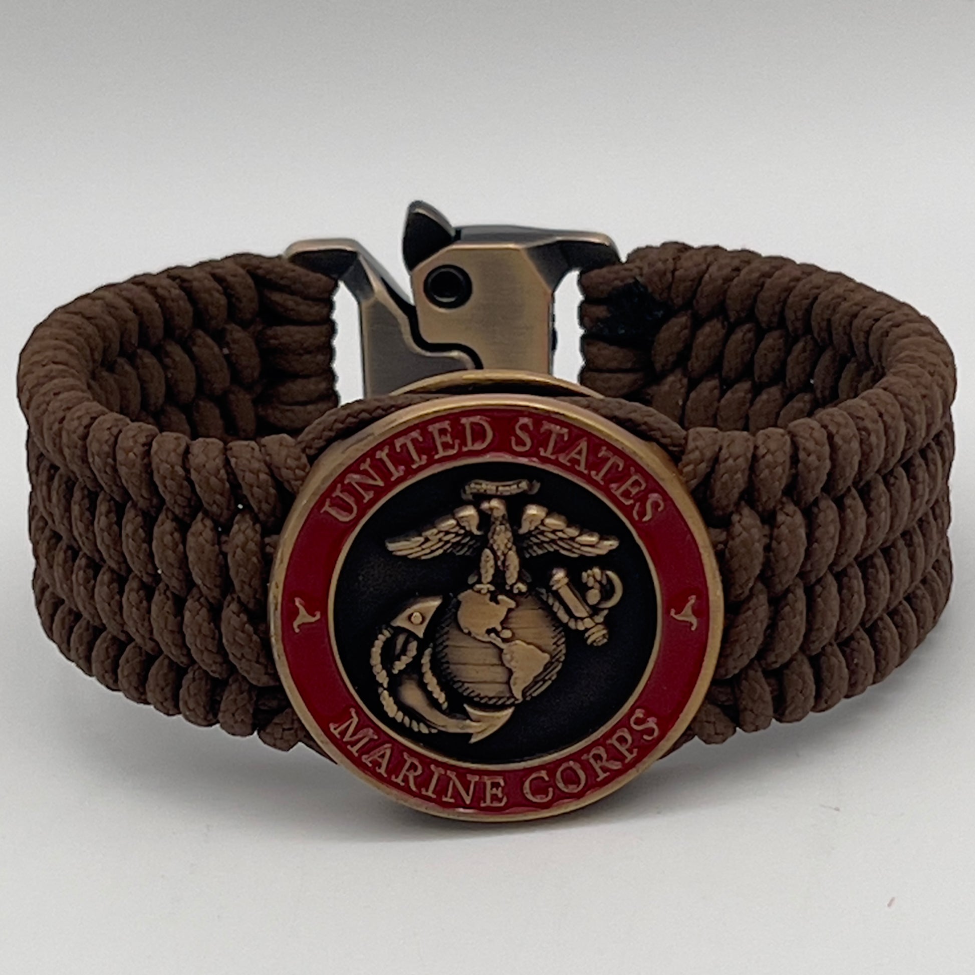 Thin, medium wide, flexible and comfortable braided United States Marine Corps bracelet featuring a 24K antique gold plated USMC Eagle Globe and Anchor medallion, a gold Cobra style tactical buckle and woven with Coyote Brown Type-1 paracord.