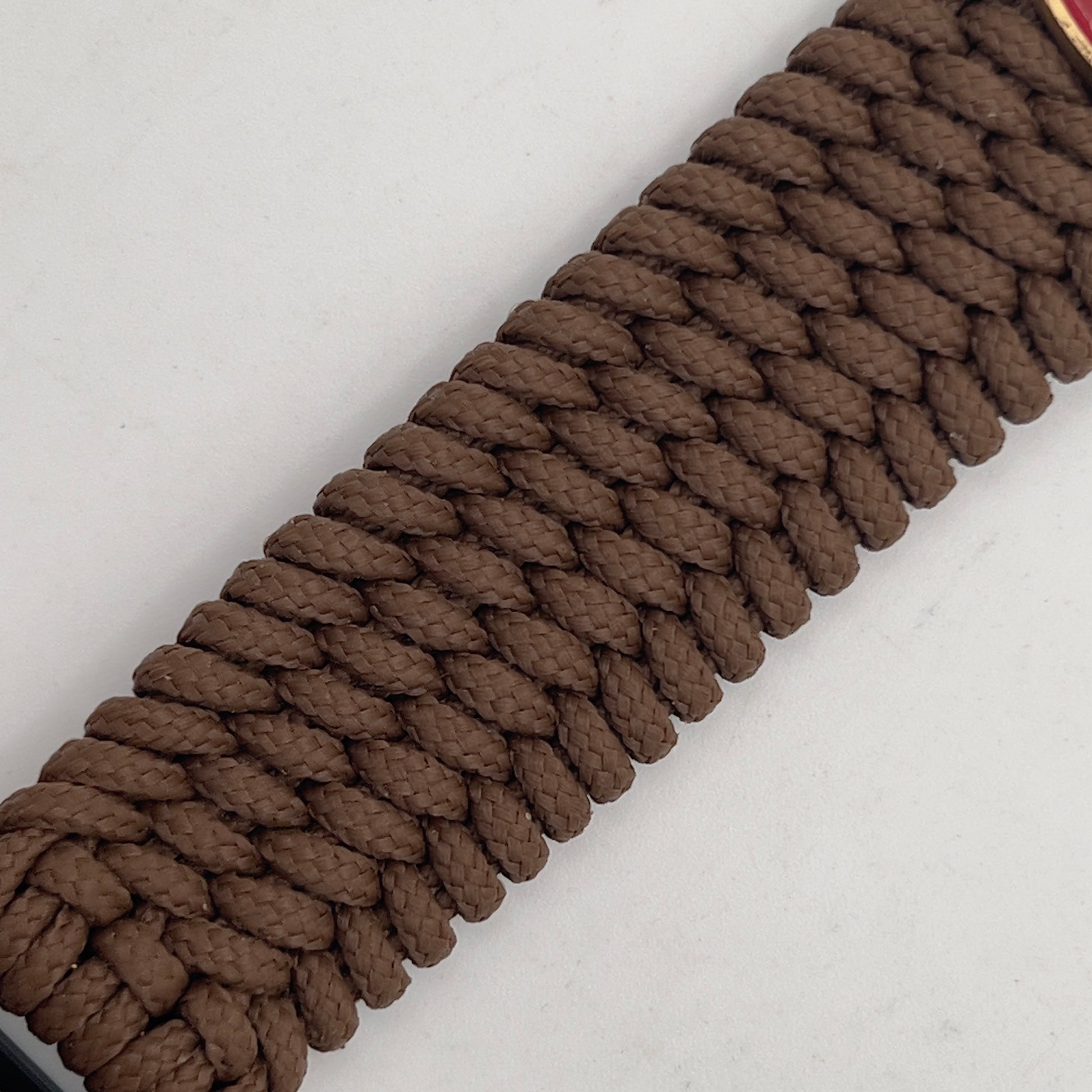 Thin, medium wide, flexible and comfortable braided United States Marine Corps bracelet featuring a 24K antique gold plated USMC Eagle Globe and Anchor medallion, a gold Cobra style tactical buckle and woven with Coyote Brown Type-1 paracord.