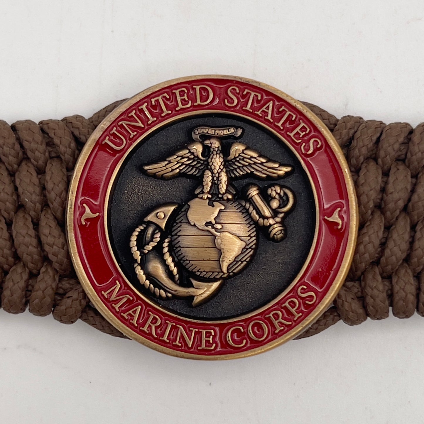Thin, medium wide, flexible and comfortable braided United States Marine Corps bracelet featuring a 24K antique gold plated USMC Eagle Globe and Anchor medallion, a gold Cobra style tactical buckle and woven with Coyote Brown Type-1 paracord.