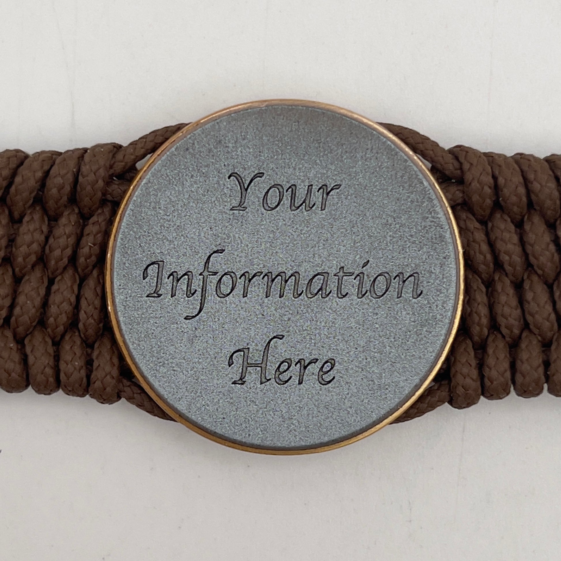 Thin, medium wide, flexible and comfortable braided United States Marine Corps bracelet featuring a 24K antique gold plated USMC Eagle Globe and Anchor medallion, a gold Cobra style tactical buckle and woven with Coyote Brown Type-1 paracord.