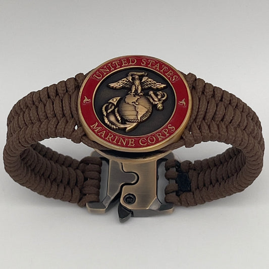 Thin, narrow, flexible and comfortable braided United States Marine Corps bracelet featuring a 24K antique gold plated USMC Eagle Globe and Anchor medallion, a gold Cobra style tactical buckle and woven with Coyote Brown Type-1 paracord.