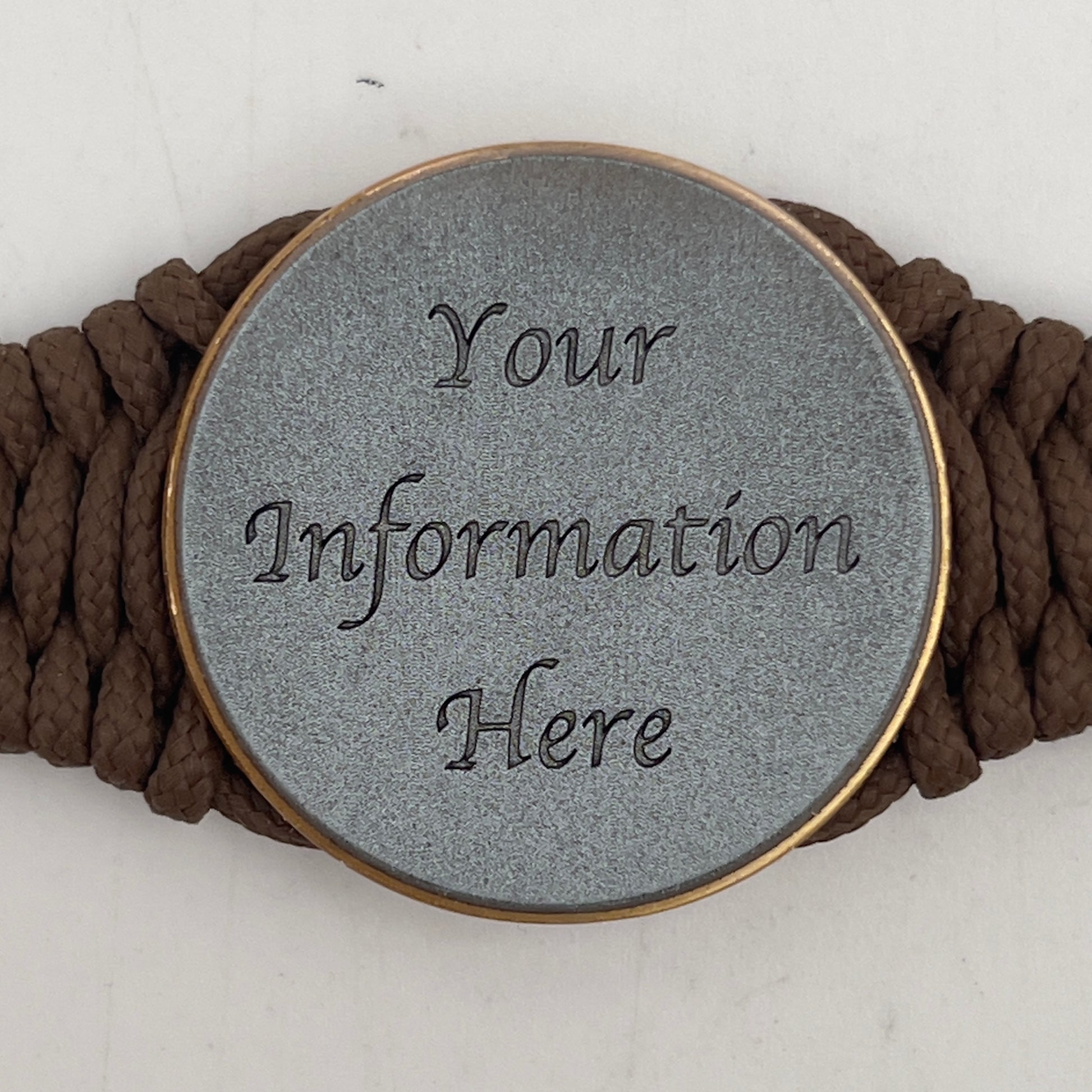 Thin, narrow, flexible and comfortable braided United States Marine Corps bracelet featuring a 24K antique gold plated USMC Eagle Globe and Anchor medallion, a gold Cobra style tactical buckle and woven with Coyote Brown Type-1 paracord.