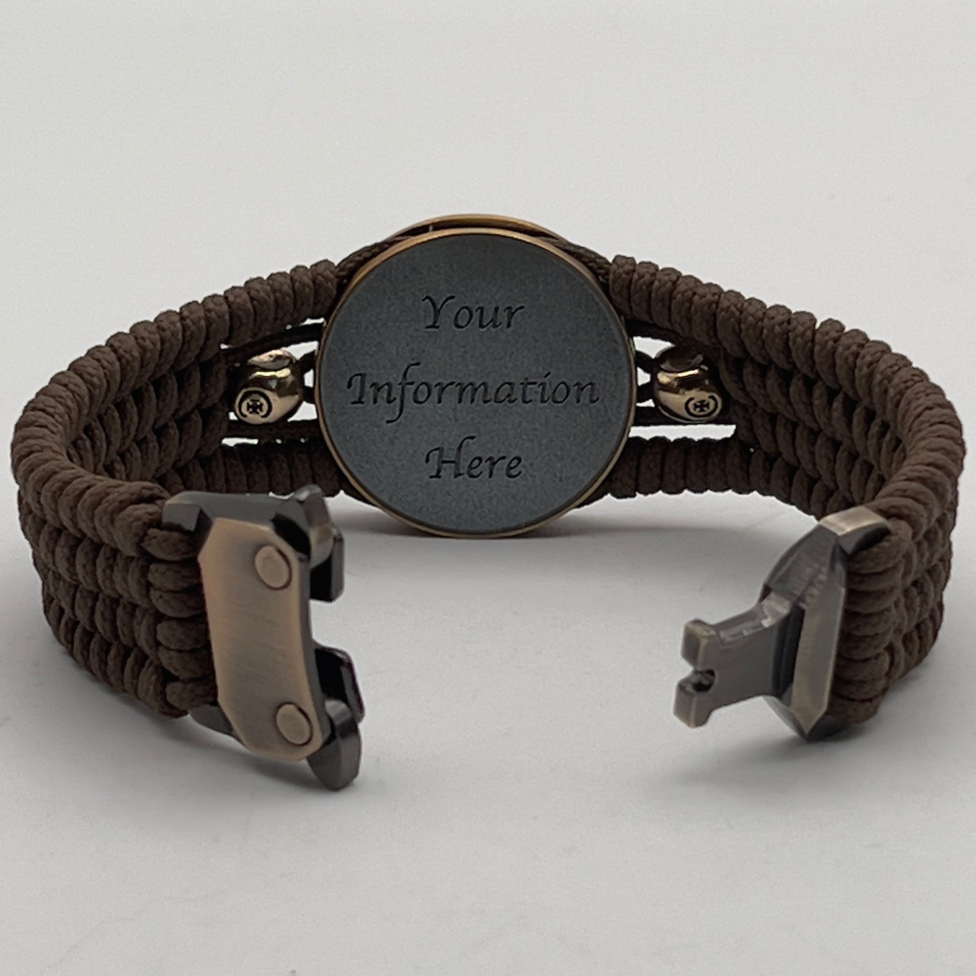 Thin, medium width, flexible and comfortable braided United States Marine Corps bracelet featuring a 24K antique gold plated USMC officer Eagle Globe and Anchor medallion, two gold plated skulls, a gold Cobra style tactical buckle and woven with Coyote Brown Type-1 paracord.