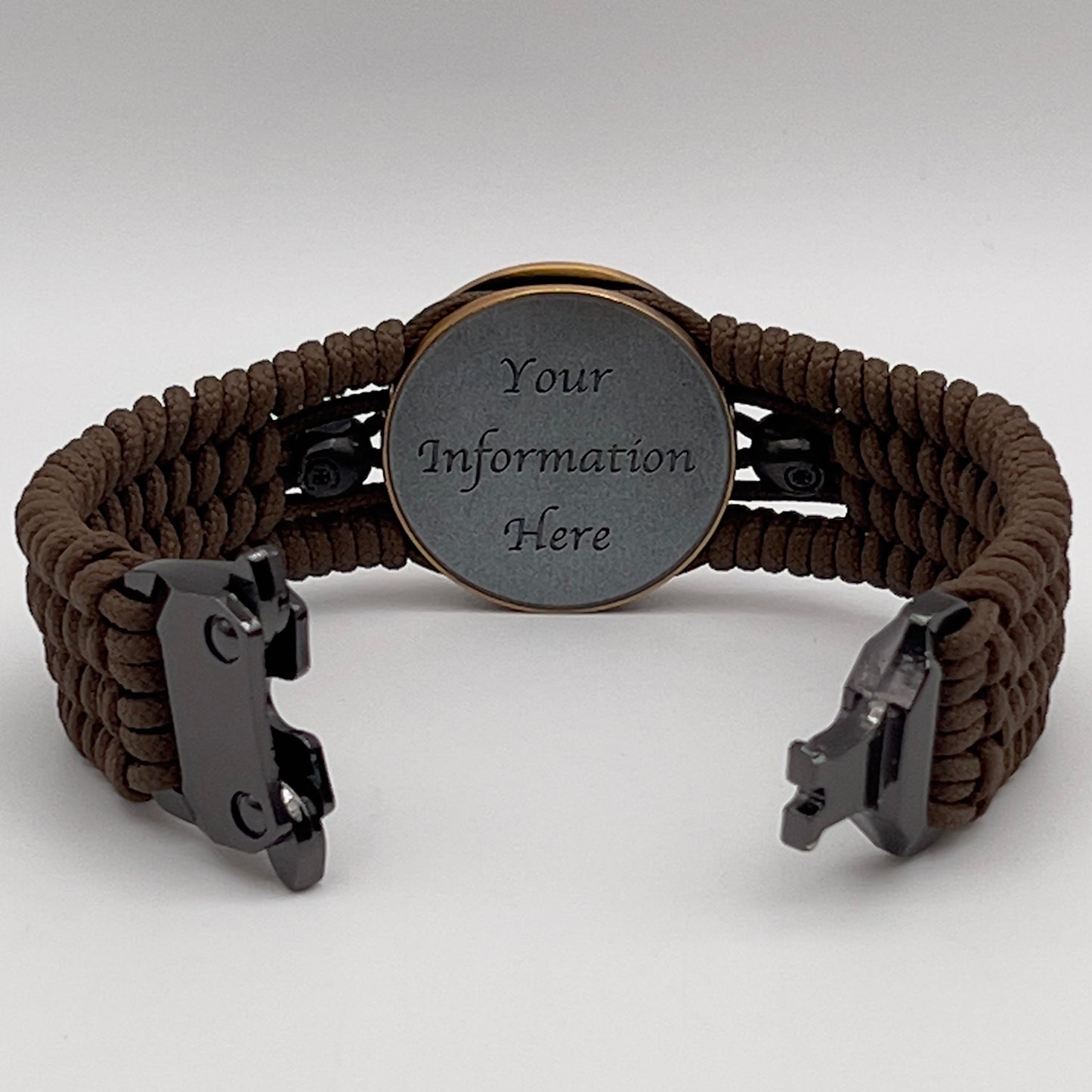 Thin, medium width, flexible and comfortable braided United States Marine Corps bracelet featuring a 24K antique gold plated USMC officer Eagle Globe and Anchor medallion, two black skulls, a black Cobra style tactical buckle and woven with Coyote Brown Type-1 paracord.