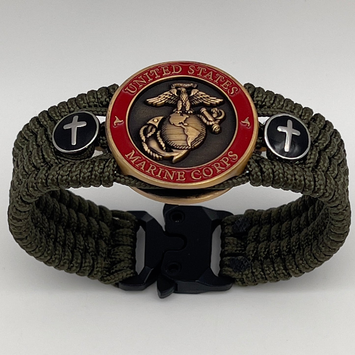Thin, medium width, flexible and comfortable braided United States Marine Corps bracelet featuring a 24K antique gold plated USMC officer Eagle Globe and Anchor medallion, two Christian crosses, a black Cobra style tactical buckle and woven with Olive Drab Type-1 paracord.