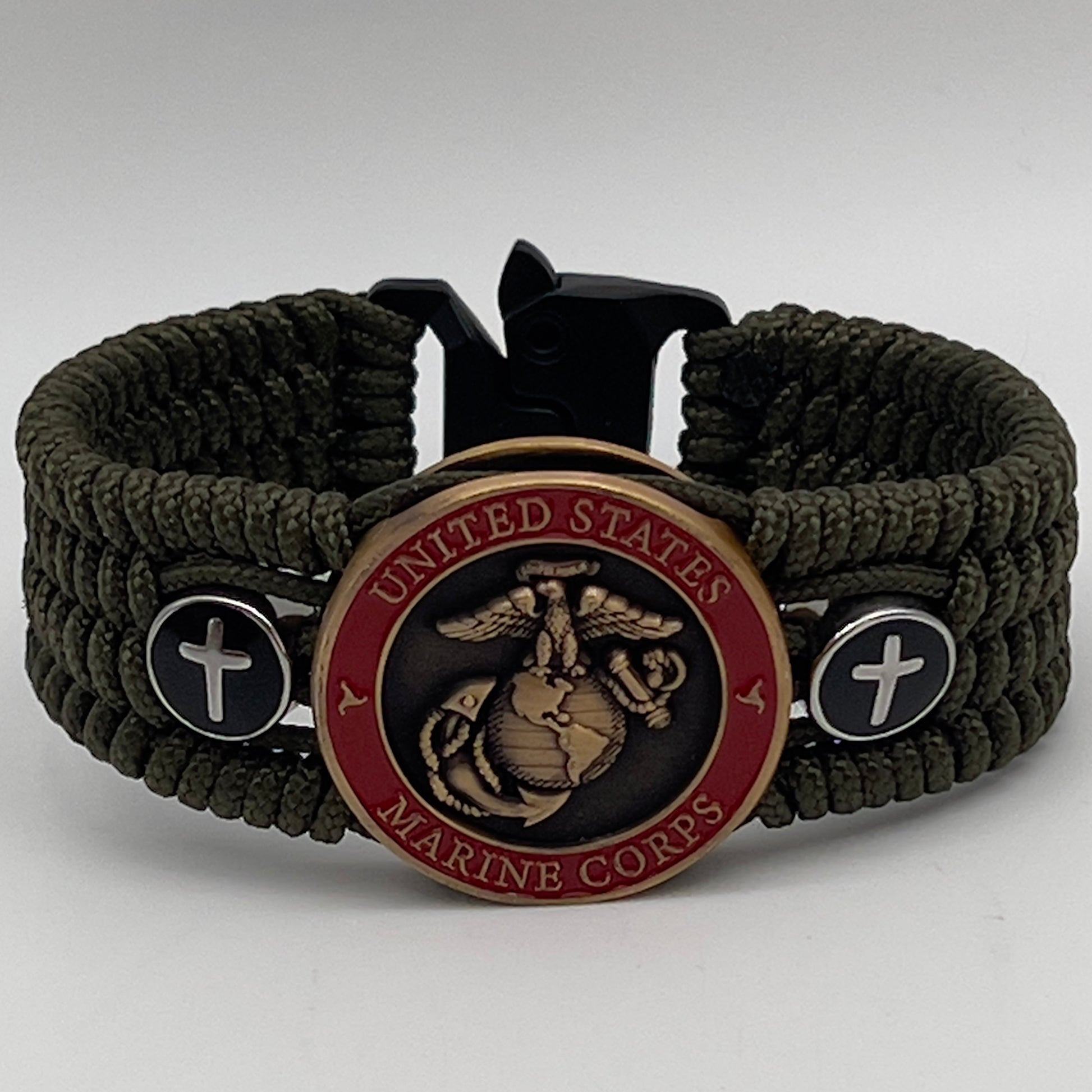 Thin, medium width, flexible and comfortable braided United States Marine Corps bracelet featuring a 24K antique gold plated USMC officer Eagle Globe and Anchor medallion, two Christian crosses, a black Cobra style tactical buckle and woven with Olive Drab Type-1 paracord.