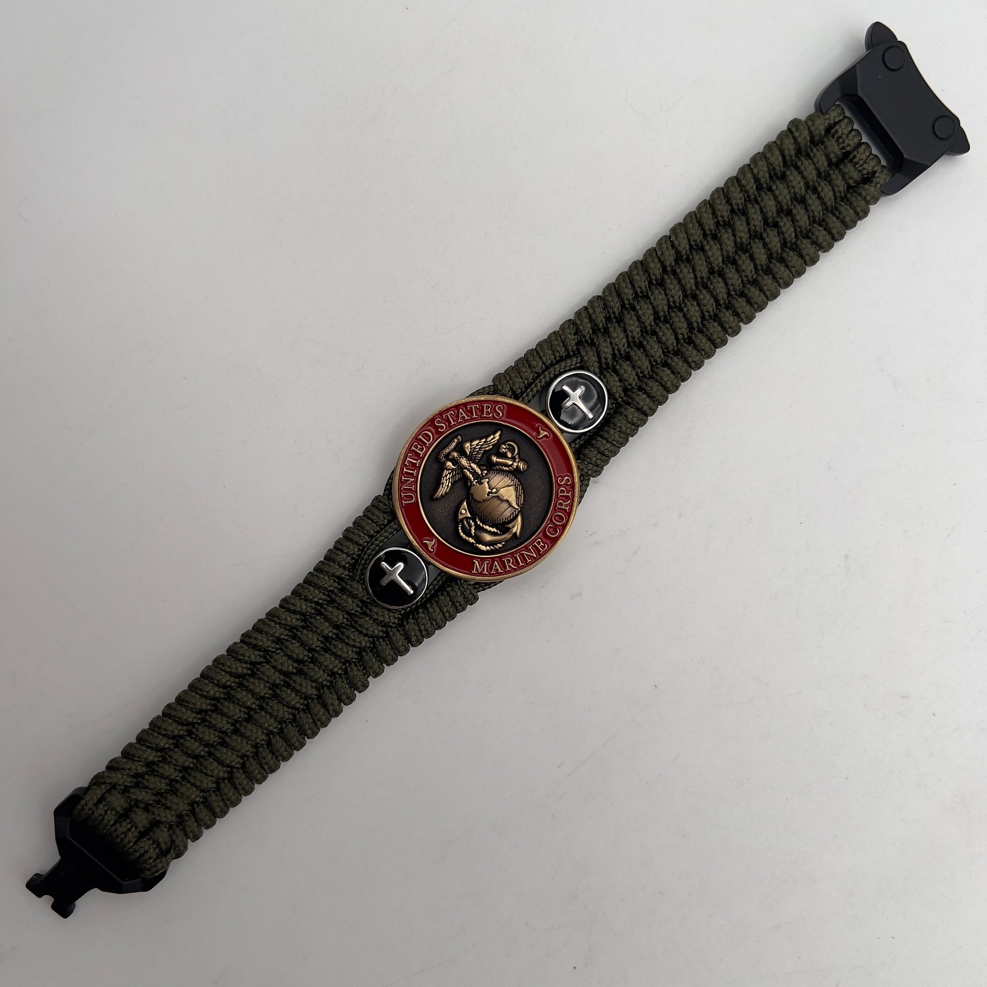 Thin, medium width, flexible and comfortable braided United States Marine Corps bracelet featuring a 24K antique gold plated USMC officer Eagle Globe and Anchor medallion, two Christian crosses, a black Cobra style tactical buckle and woven with Olive Drab Type-1 paracord.