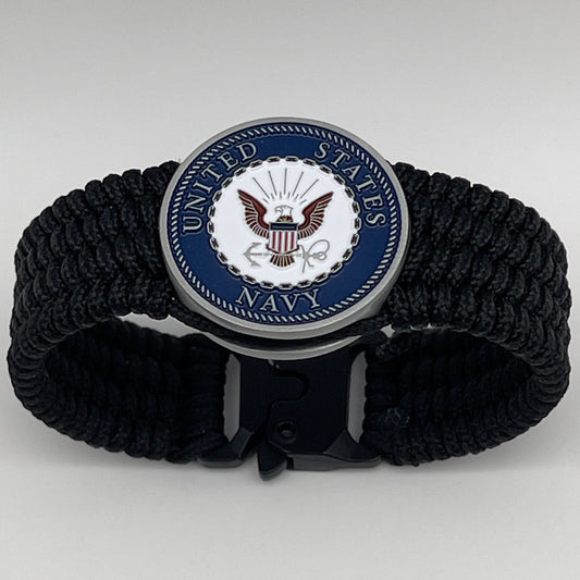 Thin, wide, flexible and comfortable braided United States Navy bracelet featuring an antique silver plated Navy medallion, a black Cobra style tactical buckle and woven with black Type-1 paracord.