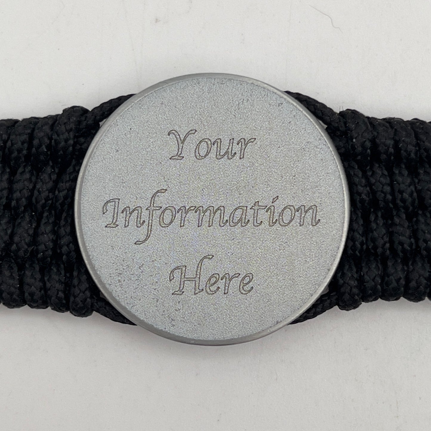 Thin, wide, flexible and comfortable braided United States Navy bracelet featuring an antique silver plated Navy medallion, a black Cobra style tactical buckle and woven with black Type-1 paracord.