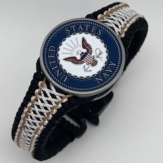 Thin, narrow, flexible and comfortable braided United States Marine Corps bracelet featuring an antique silver plated United States Navy medallion, a black Cobra style tactical buckle and woven with black Type-1 paracord and Gold adn White nano cord.
