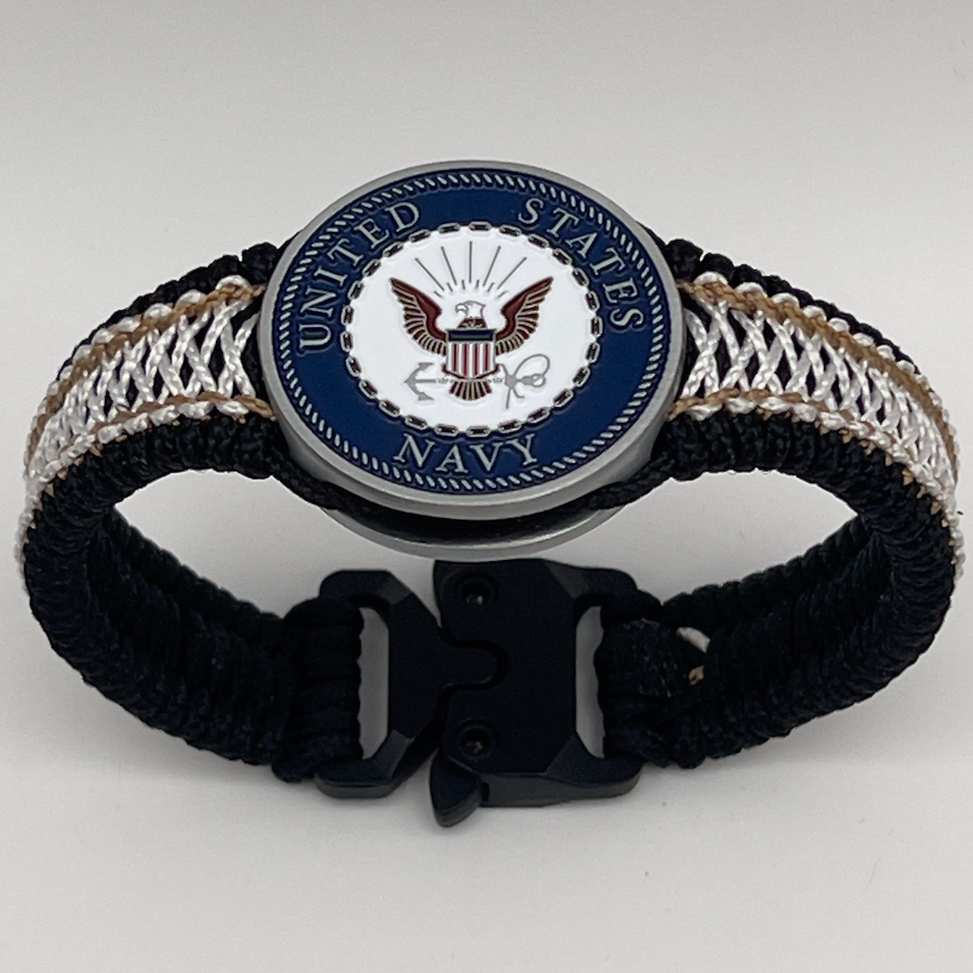 Thin, narrow, flexible and comfortable braided United States Marine Corps bracelet featuring an antique silver plated United States Navy medallion, a black Cobra style tactical buckle and woven with black Type-1 paracord and Gold adn White nano cord.