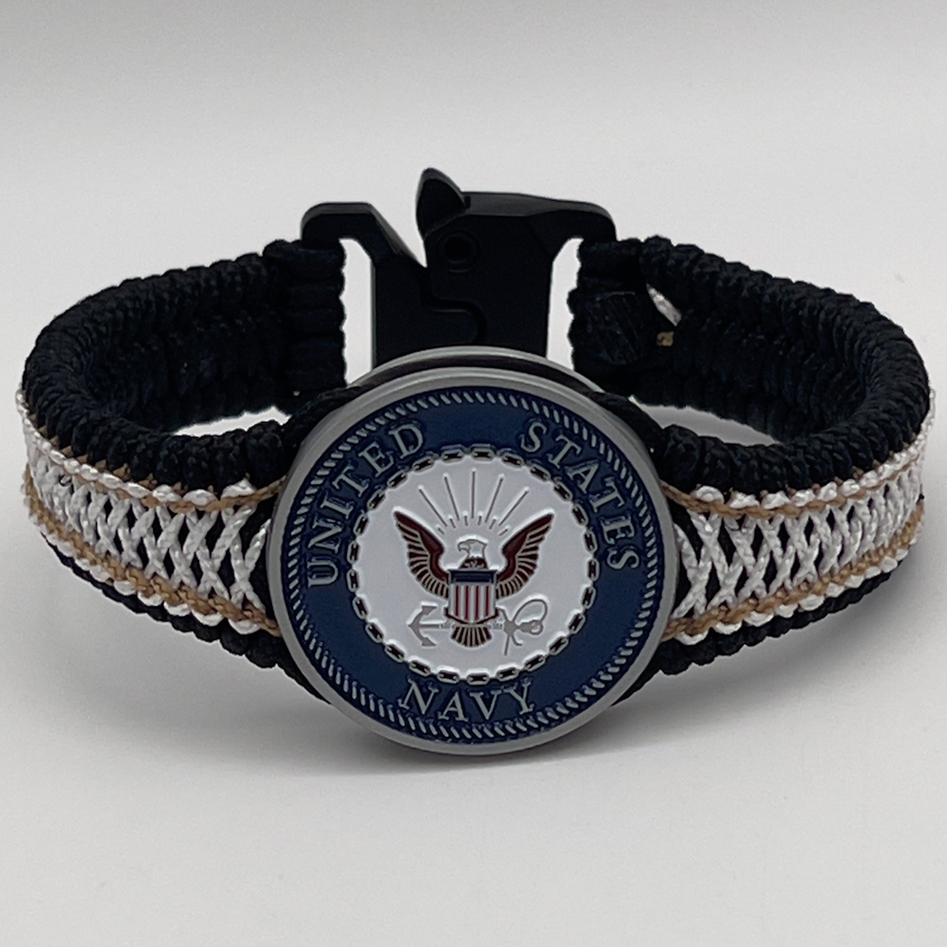 Thin, narrow, flexible and comfortable braided United States Marine Corps bracelet featuring an antique silver plated United States Navy medallion, a black Cobra style tactical buckle and woven with black Type-1 paracord and Gold adn White nano cord.
